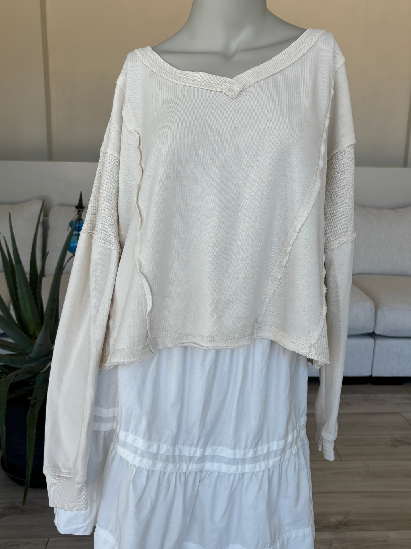 Altar’d State ivory exposed seam pullover sweatshirt styled for cozy everyday wear