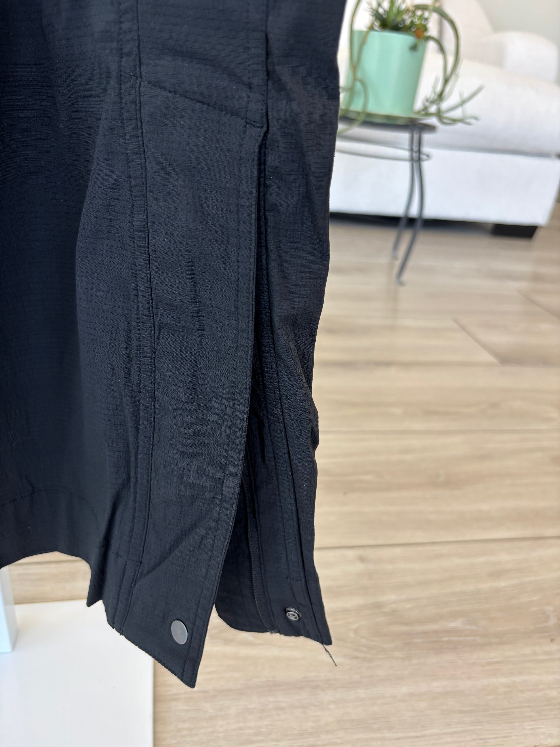 Athleta crisp nylon blend pants in black with cinch waist and zip vent ankles for sporty casual styling