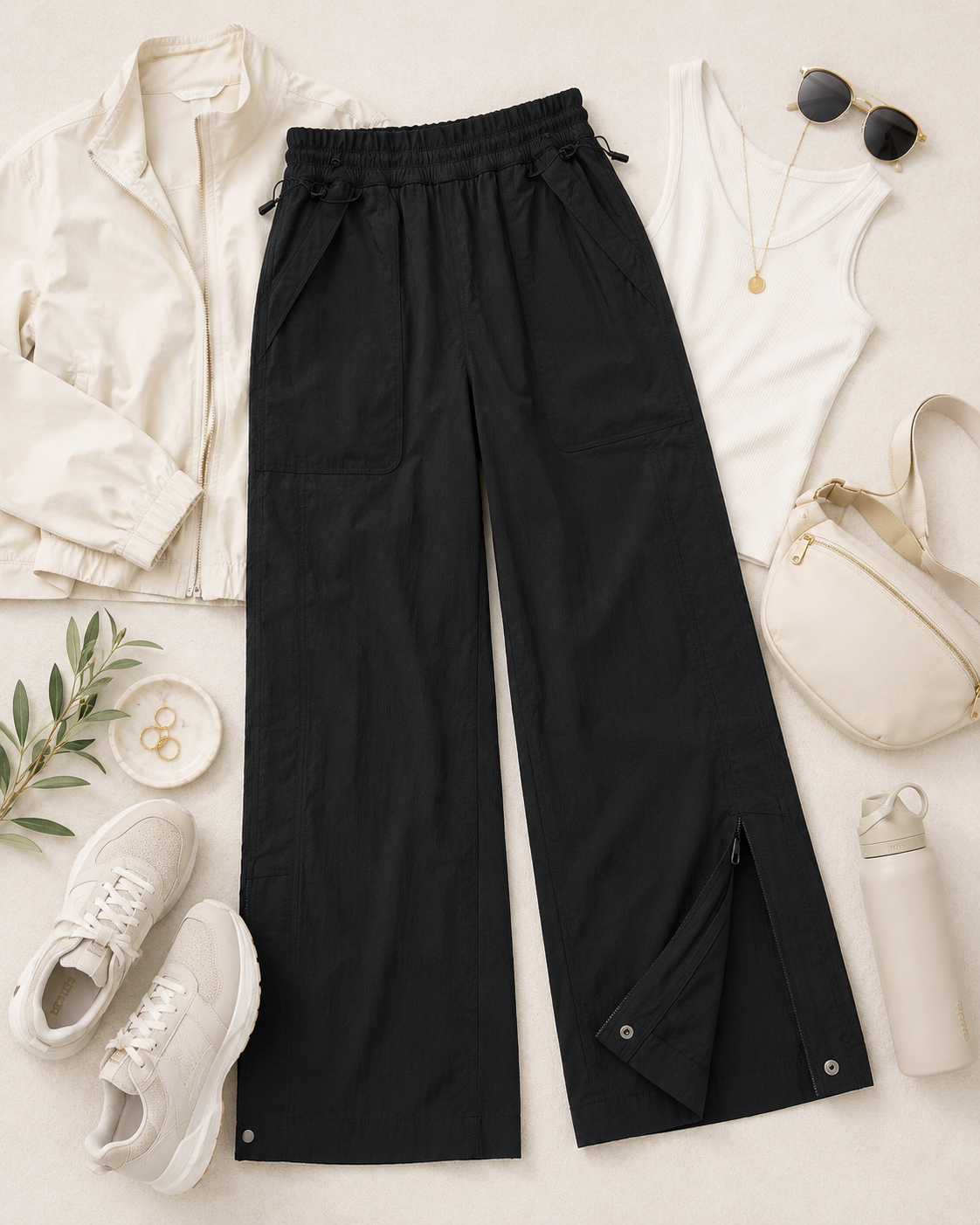 Athleta size 6 black nylon spandex pants with adjustable waist and ankle zipper vents styled for everyday athleisure