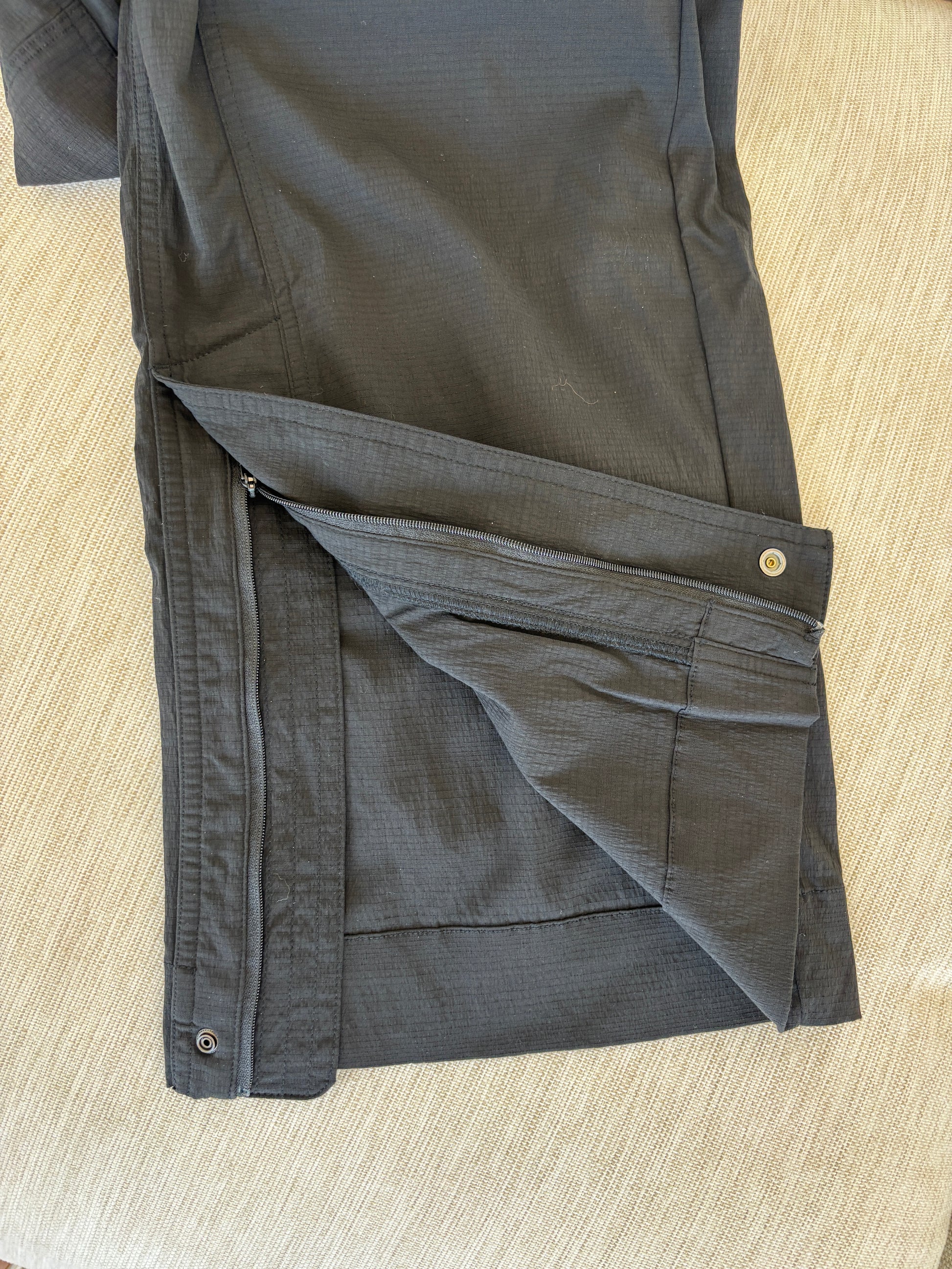 Athleta black athleisure pants with gathered waistband and versatile zip ankle opening