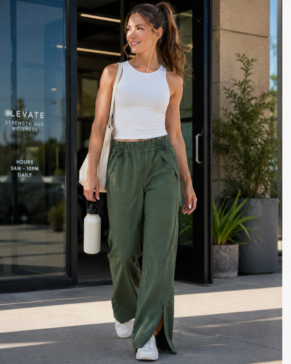Athleta dark olive cinch waist zip vent pants size 6 with crisp nylon blend fabric from Adored Again boutique
