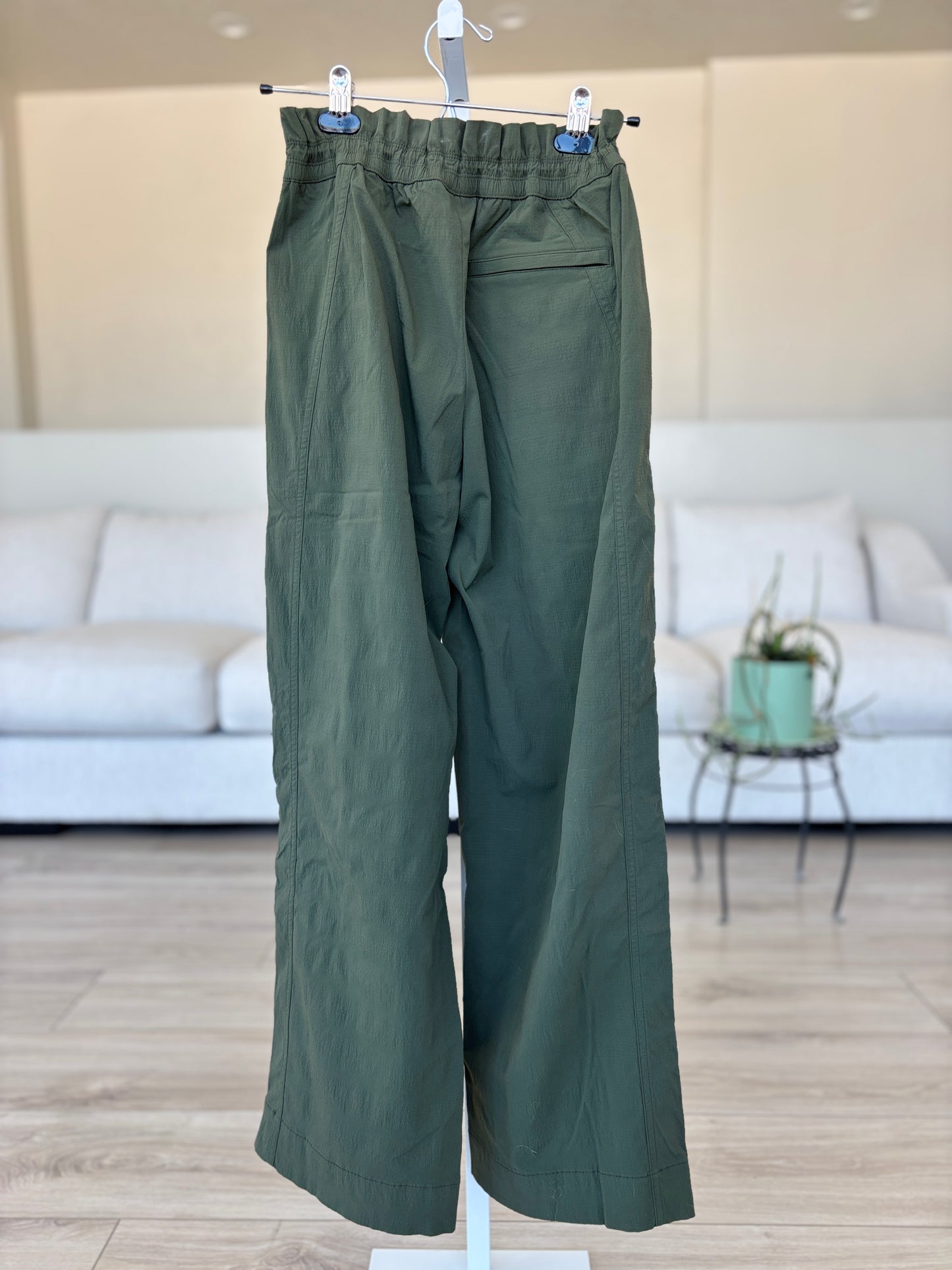 Athleta crisp nylon blend pants in dark olive green with cinch waist and zip vent ankles for sporty casual styling