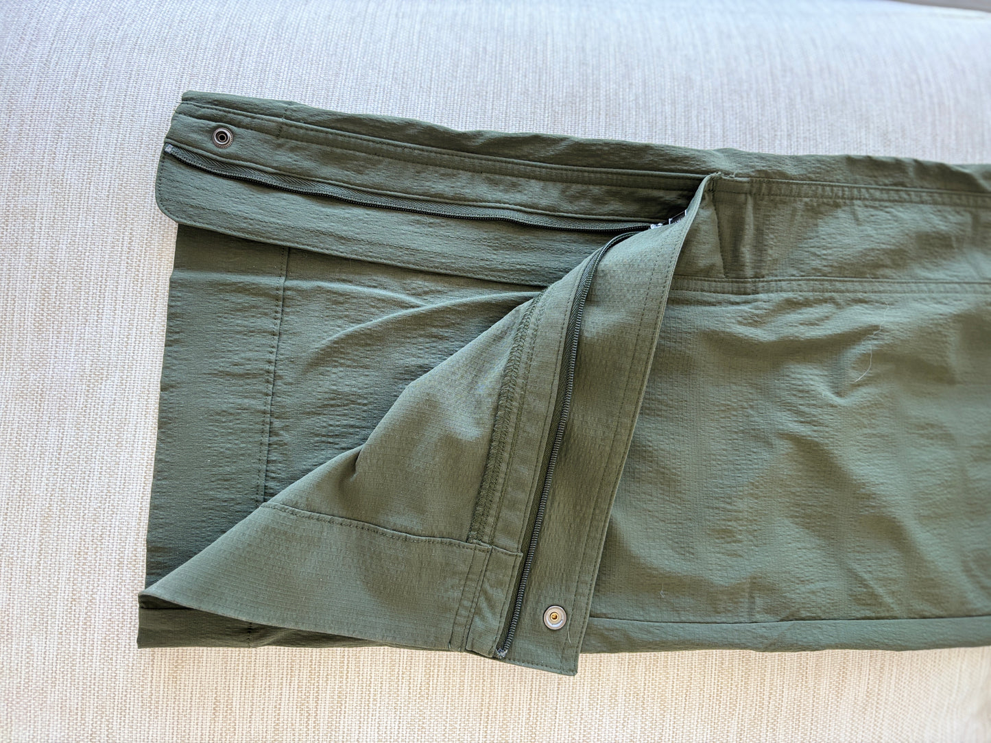 Athleta olive athleisure pants with gathered waistband and versatile zip ankle opening