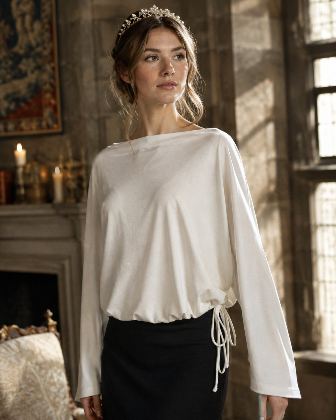 Ivory Athleta modal-blend top featuring a relaxed batwing silhouette, wide neckline, and adjustable bubble hem.
