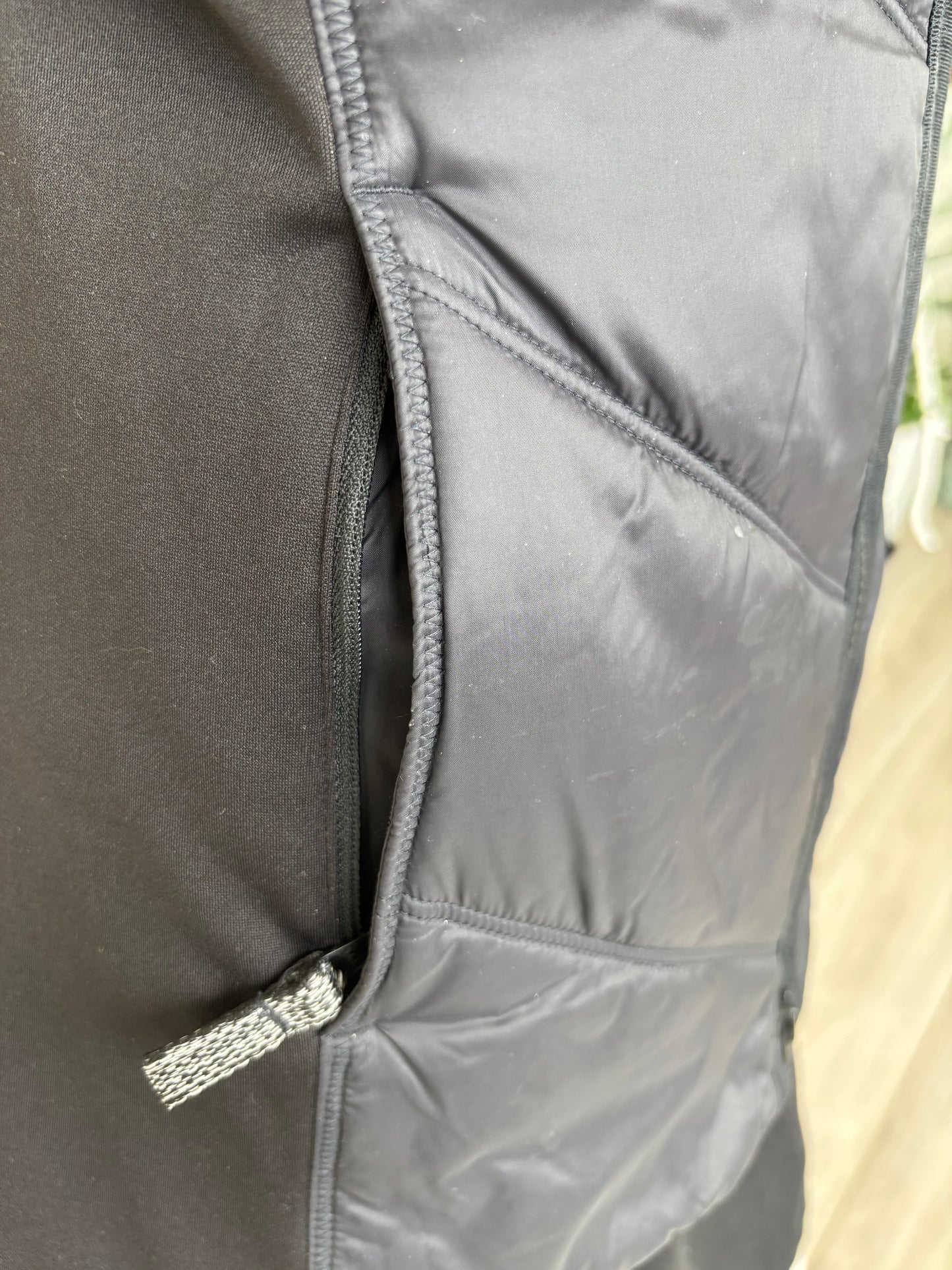 Light brown metallic Athleta vest quilted linline puffer vest for warm stylish layering in cold weather. pocket detail
