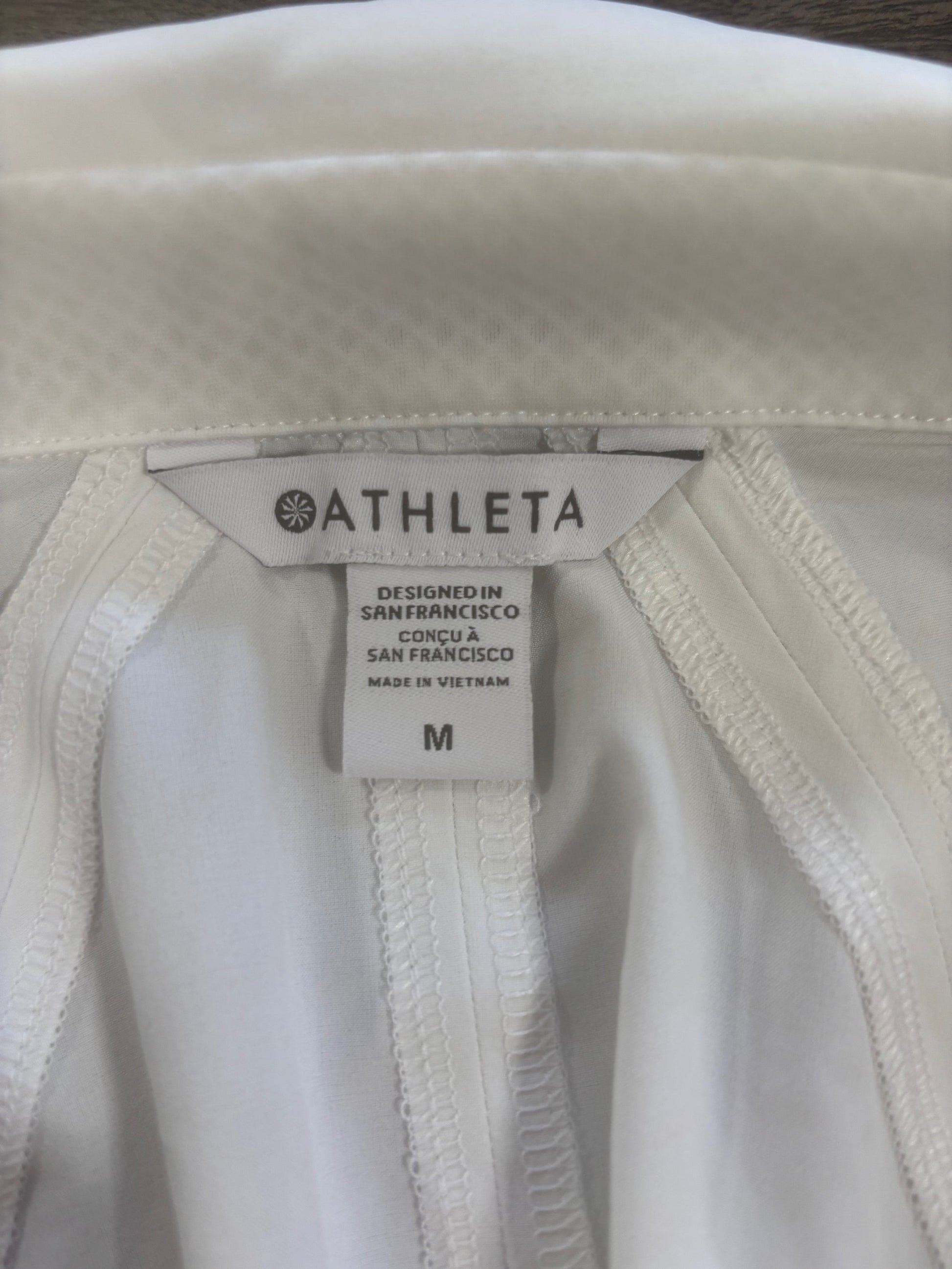 Athleta cream half-zip pullover size M-official tag, wicking fabric around collar