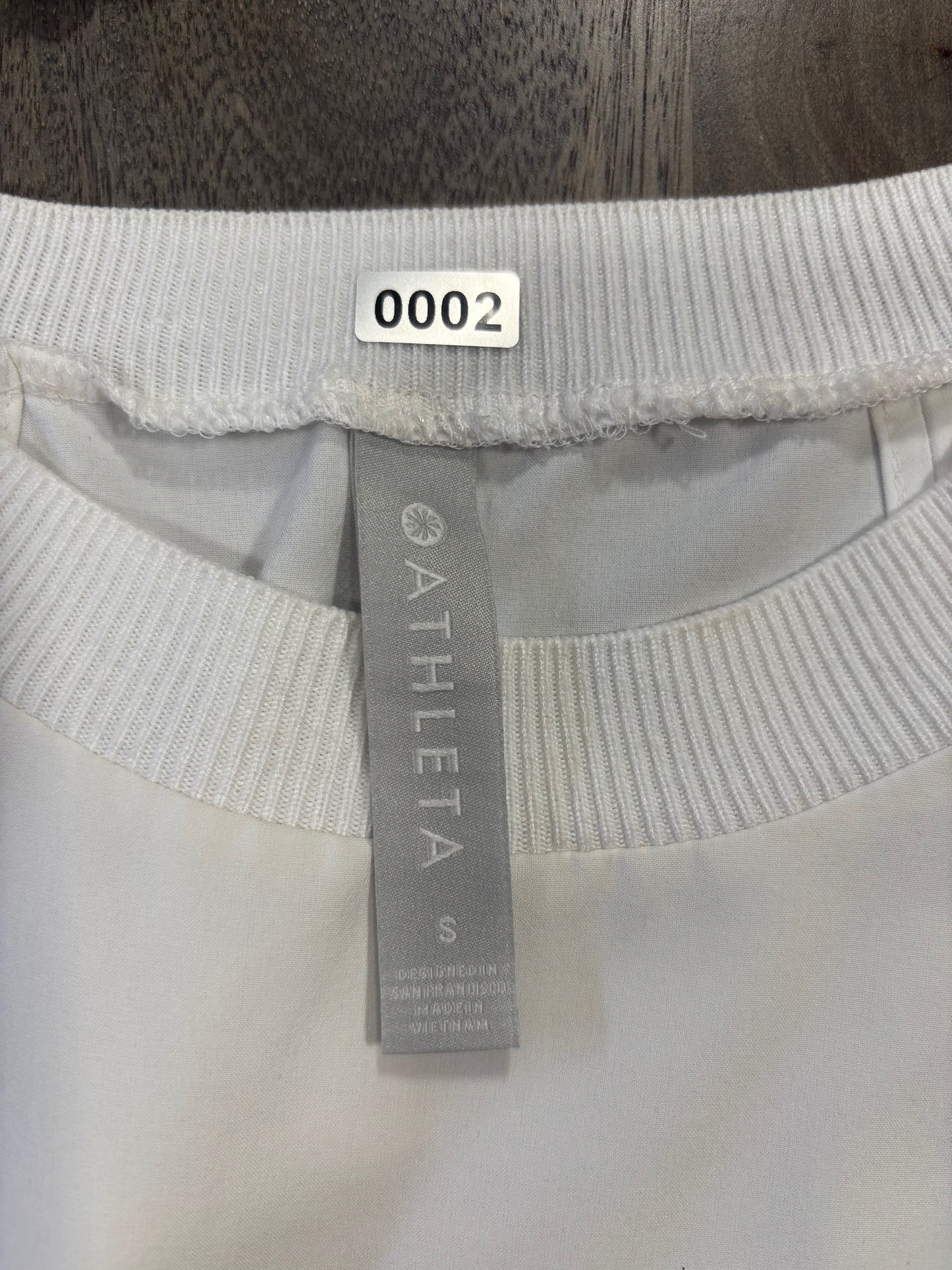 Athleta Summit Spirit tank top tag detail showing brand and size information