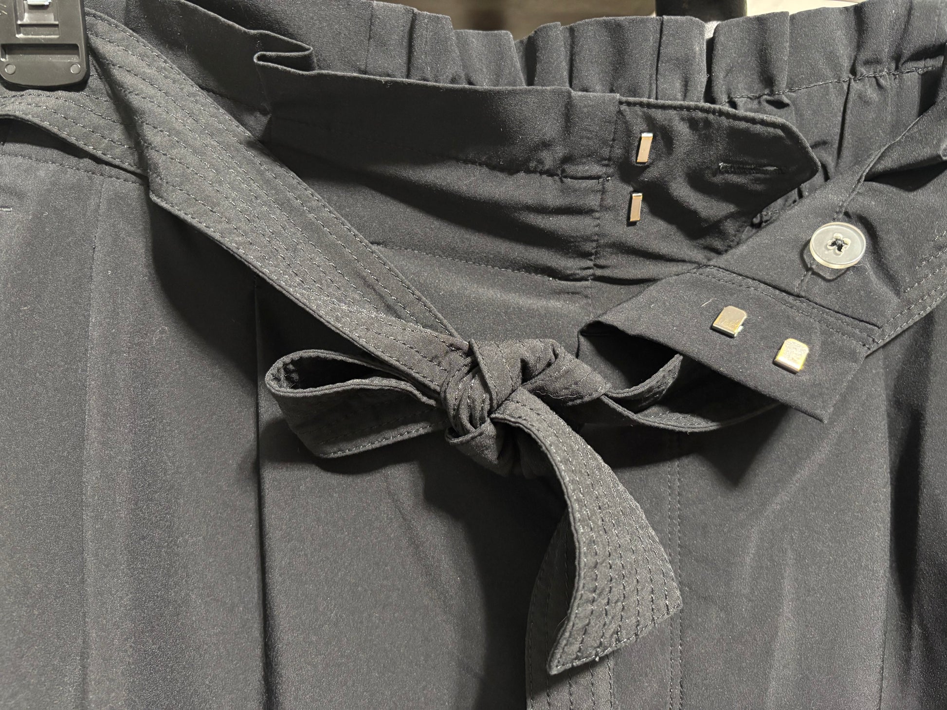 Athleta Black Dress pants, clasp and button closures, zipper, ruffle detail on top. Straight leg