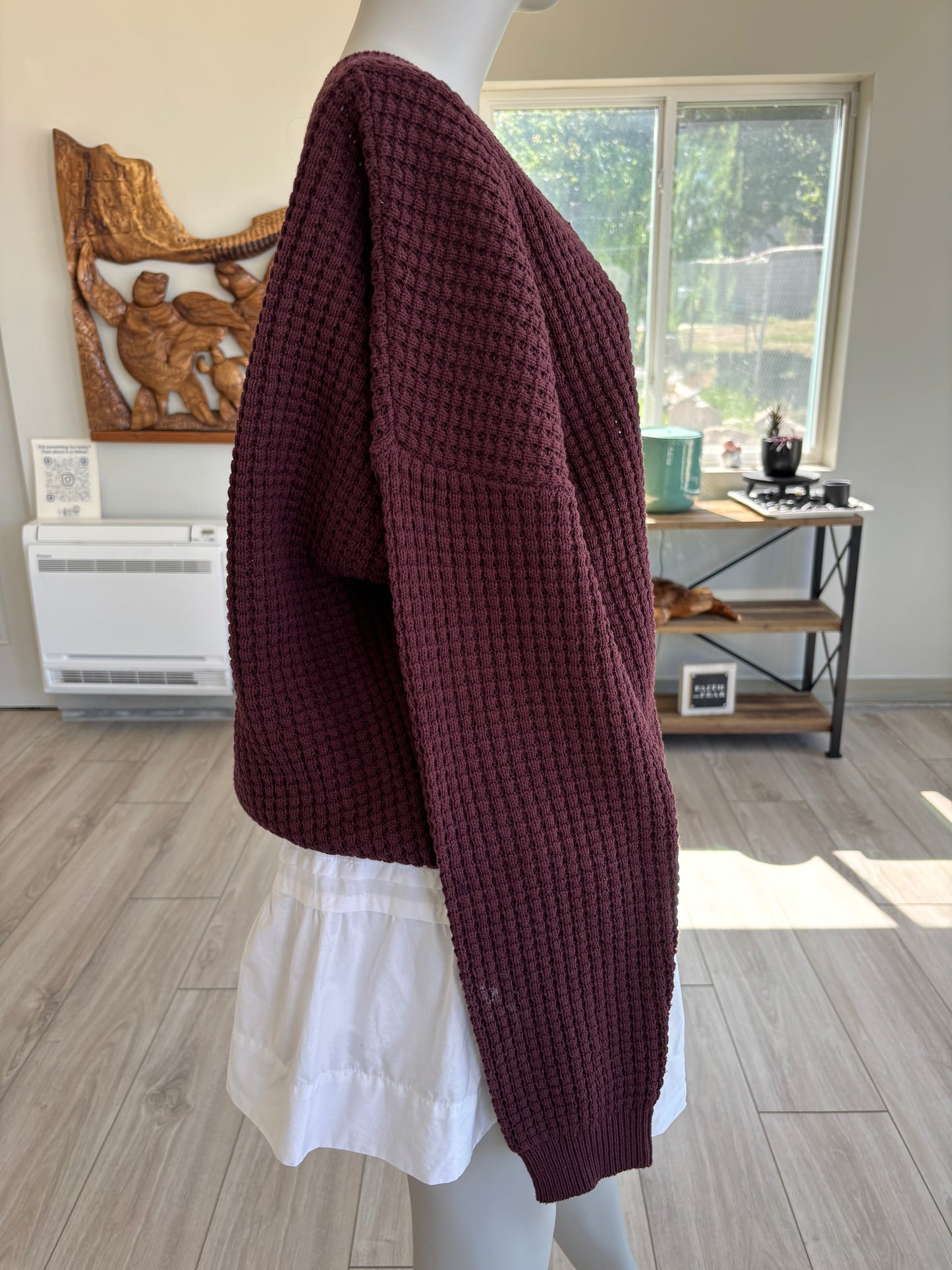 BOHME deep red V-neck sweater styled for cozy everyday wear