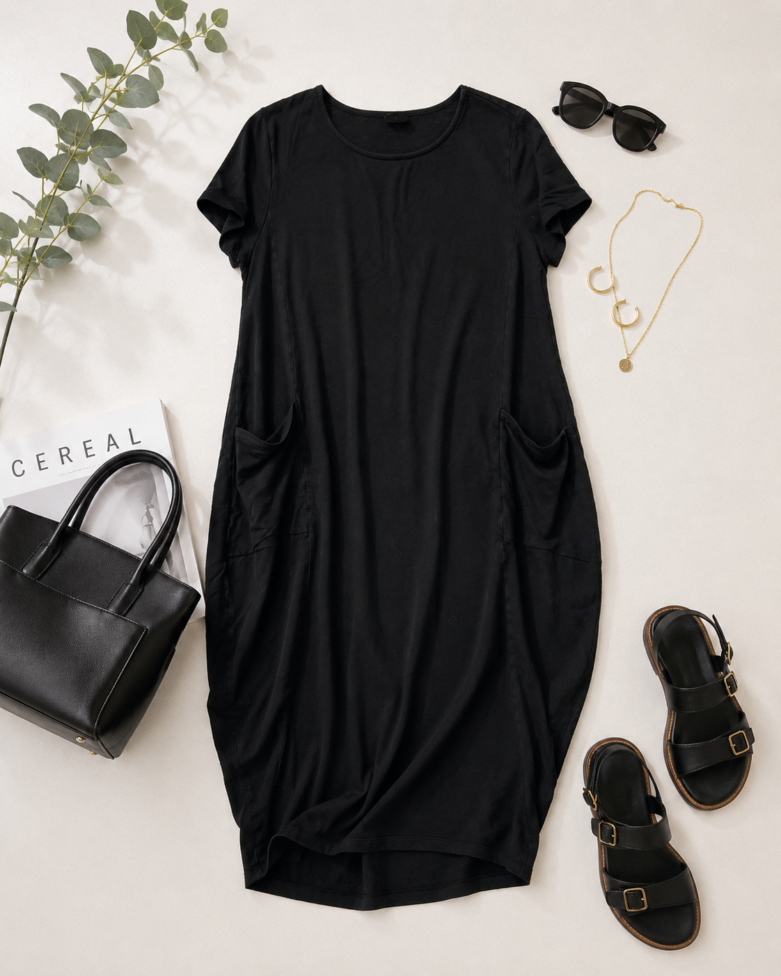 Black casual knit style dress with oversized slouchy side pockets