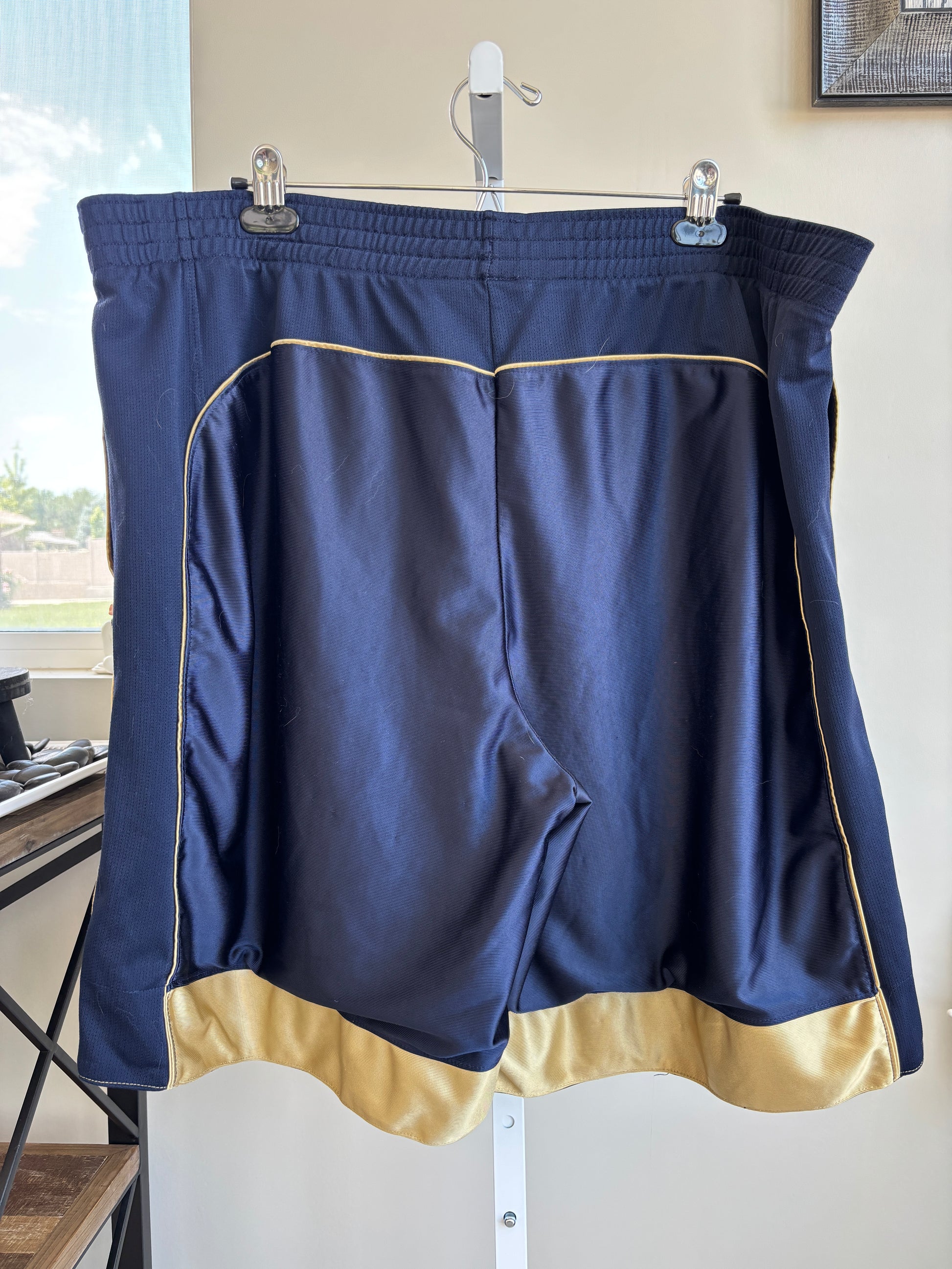 Champion men’s 2XL navy athletic shorts with gold side stripes