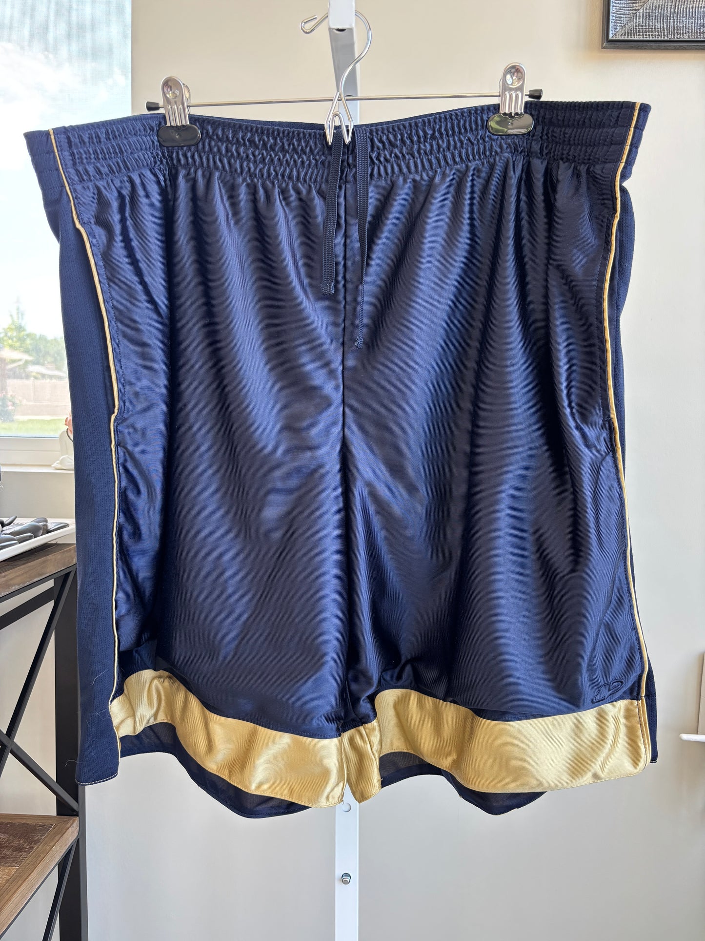 Champion men’s navy blue and gold athletic shorts size 2XL front view