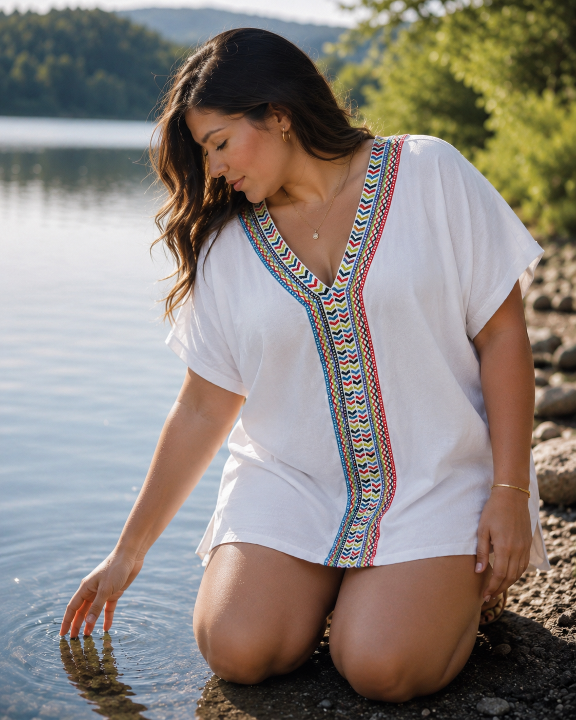 White cotton embroidered top with colorful artisan-inspired detailing, relaxed short sleeve fit, and elevated boho boutique style.