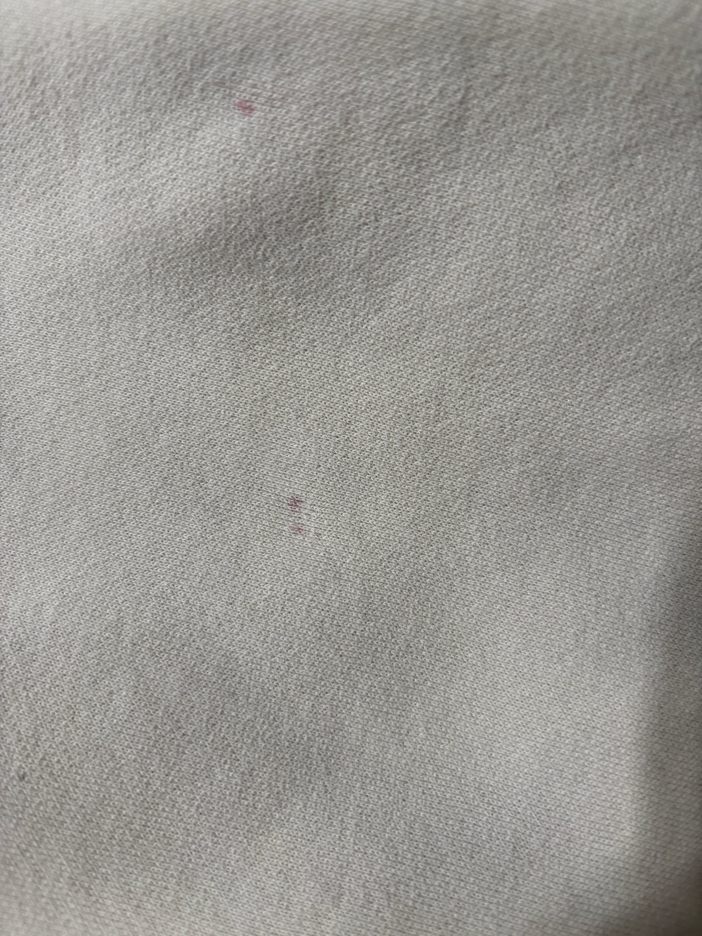 very good condition with tiny little red spots.  such a great hoodie. Solid