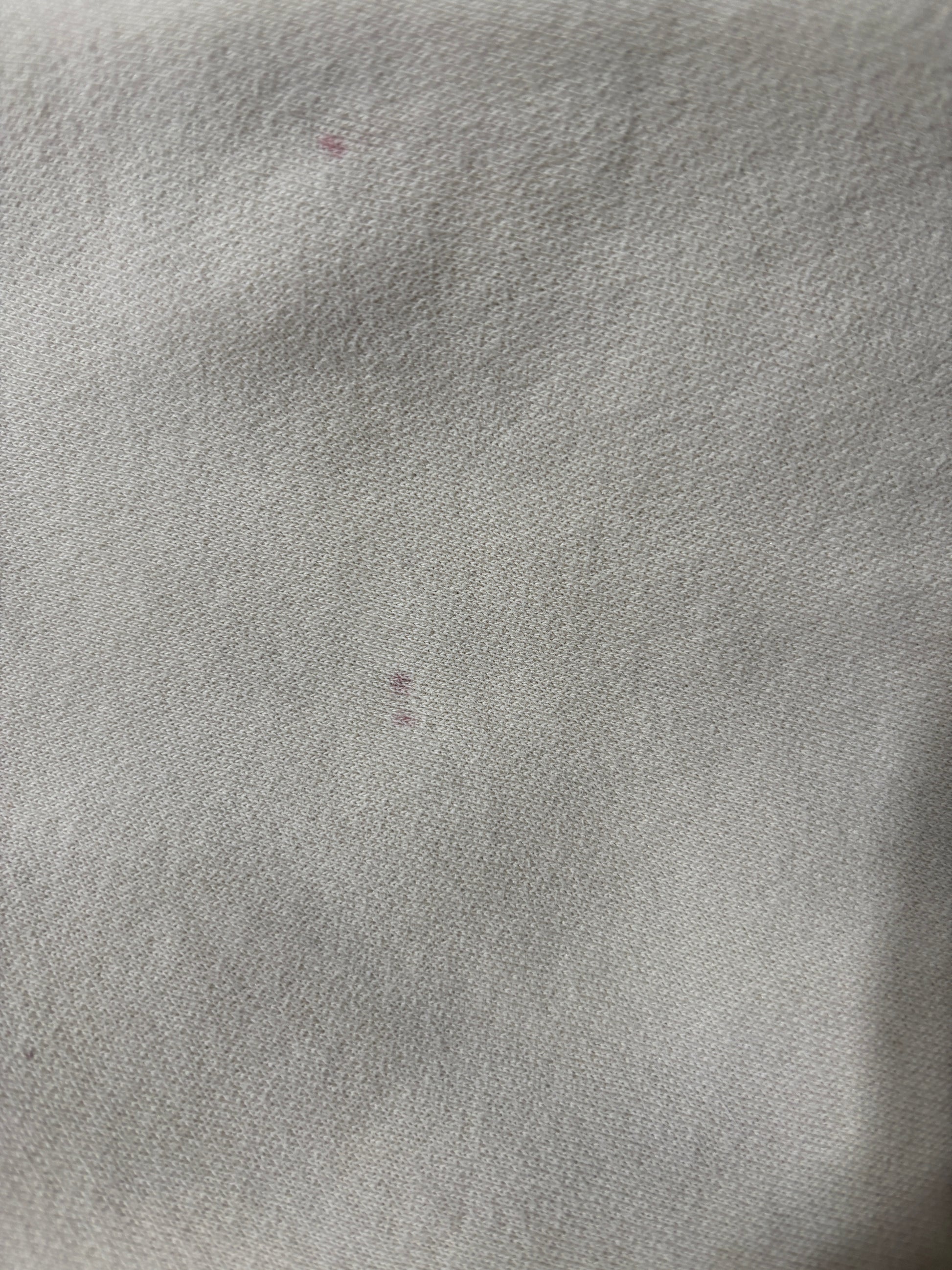 very good condition with tiny little red spots.  such a great hoodie. Solid