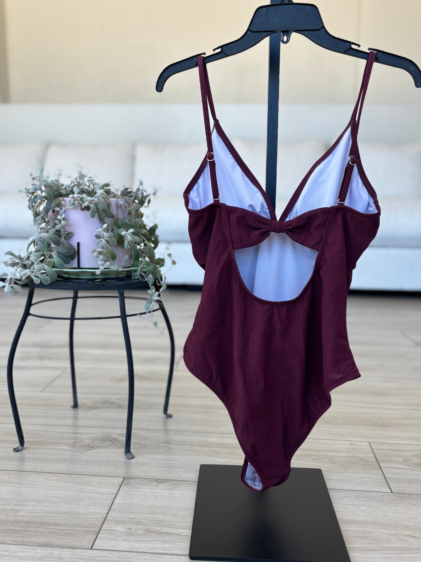 Dark maroon Cupshe swimsuit with ruched front and feminine shaping
