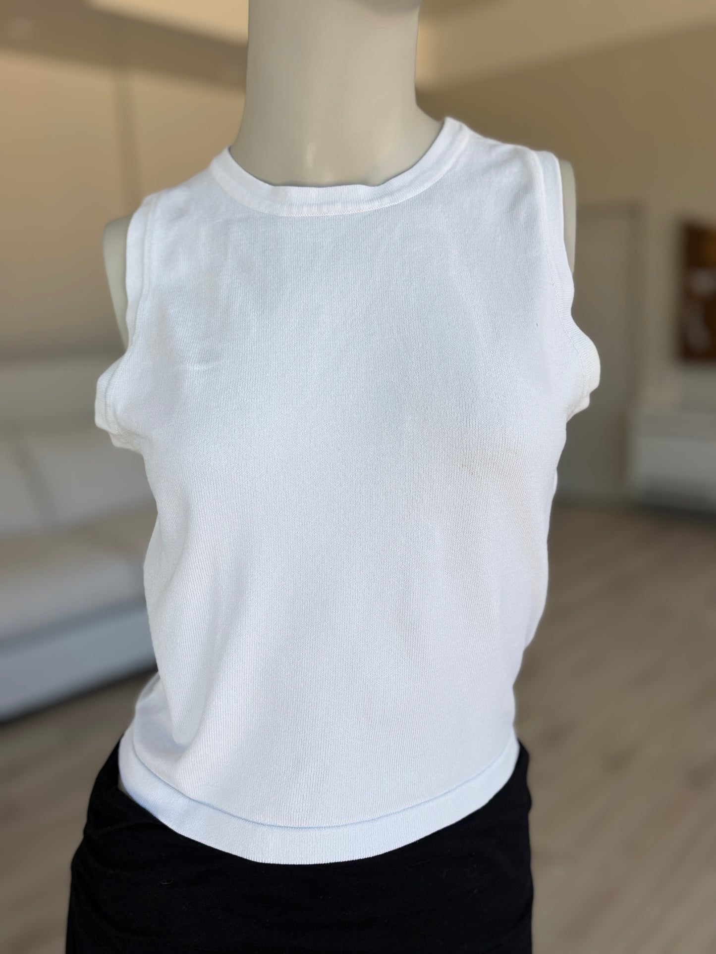 White Forever 21 sleeveless knit top styled as an elevated basic