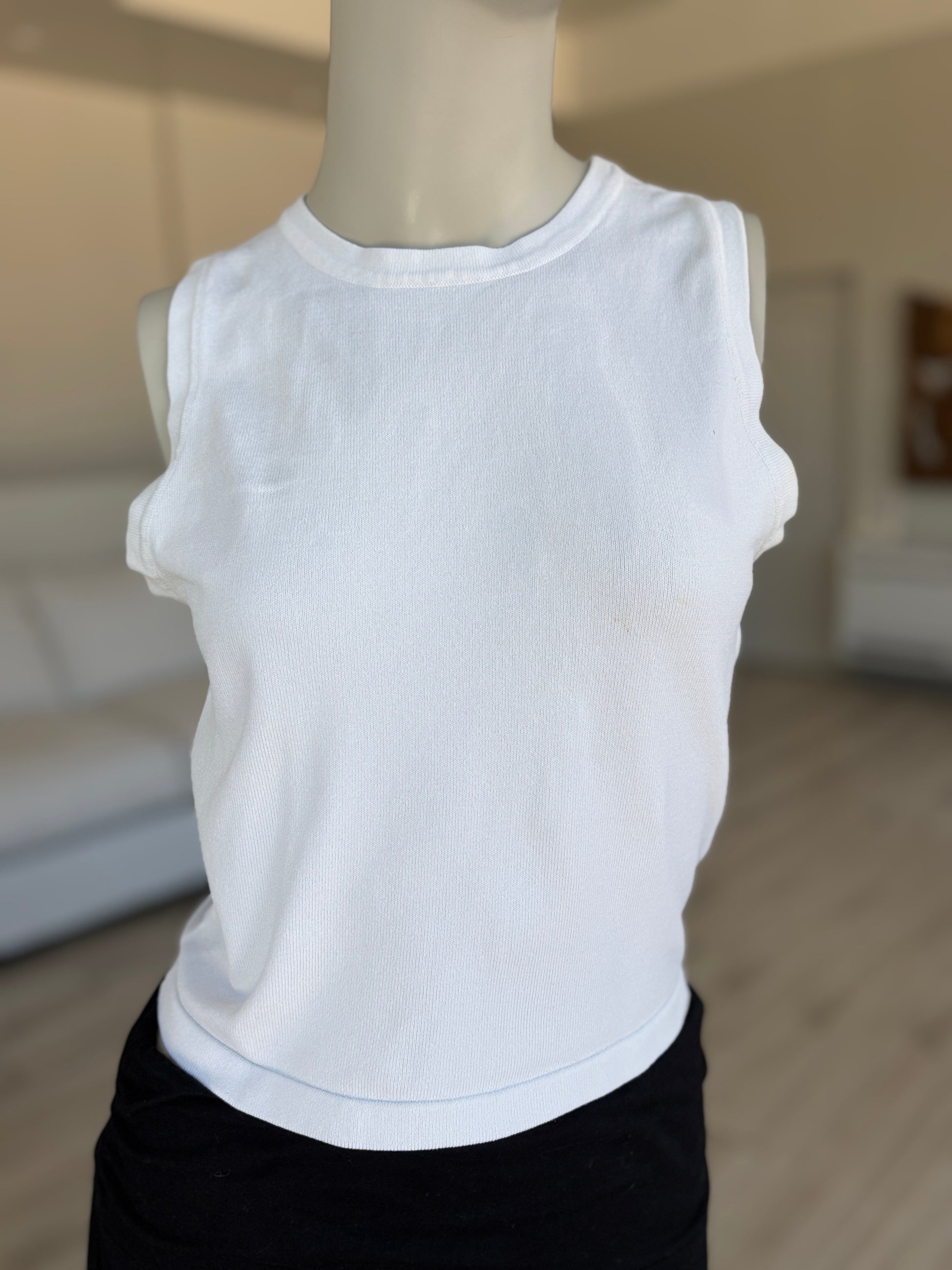 White Forever 21 sleeveless knit top styled as an elevated basic