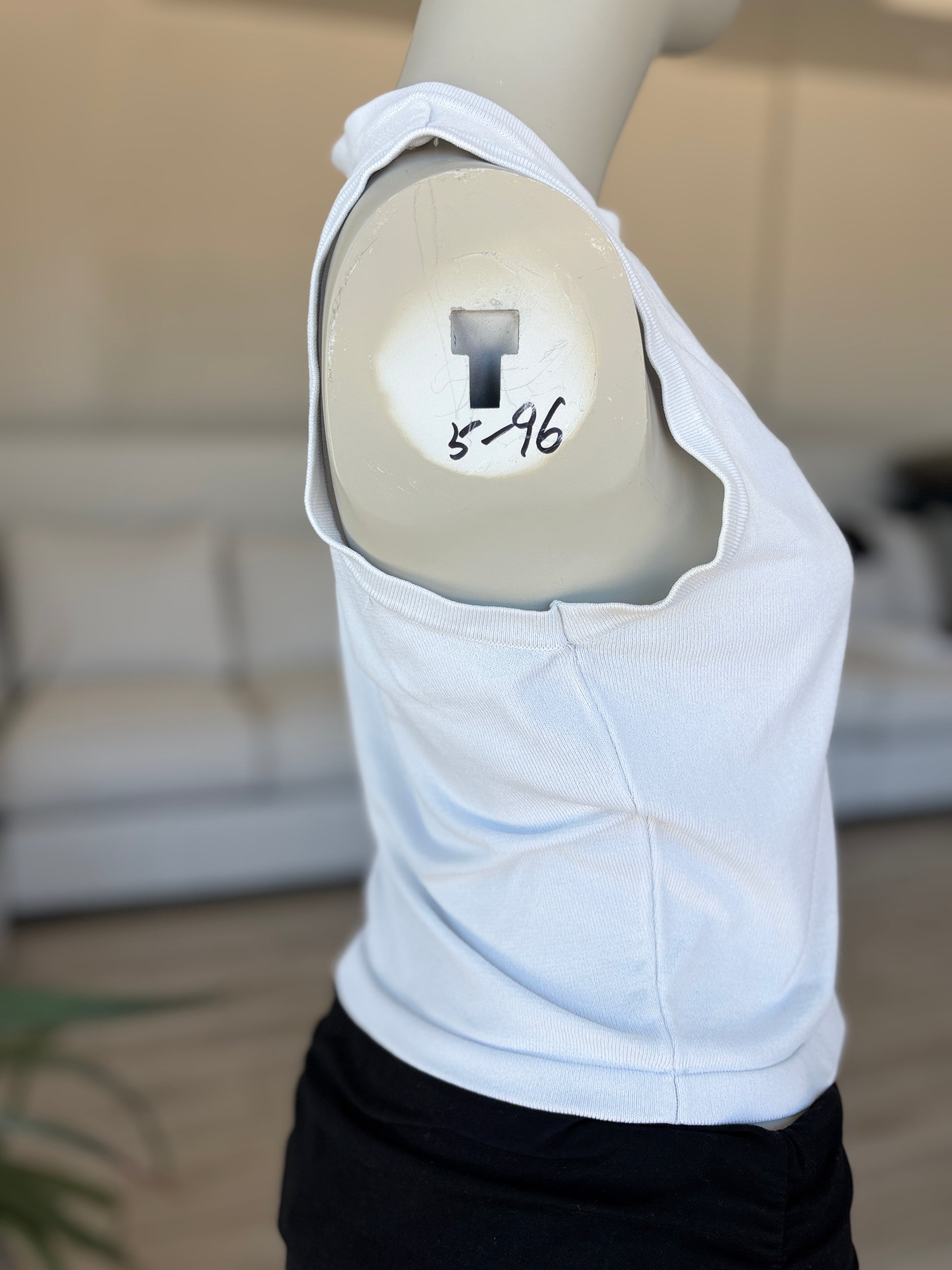 White fitted Forever 21 tank top with slightly wider shoulder coverage