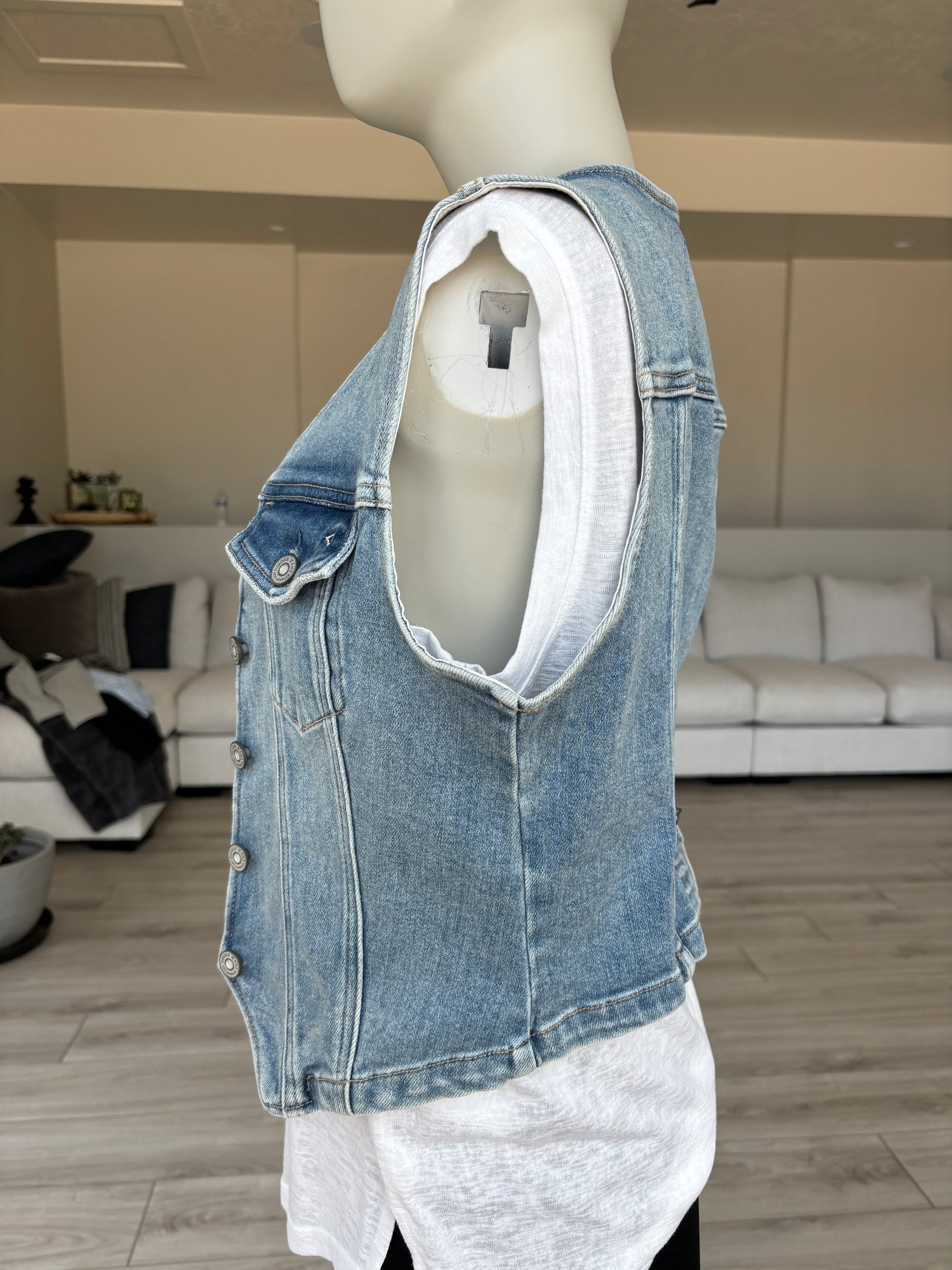 Hidden light wash denim vest with button front and flattering seaming size M