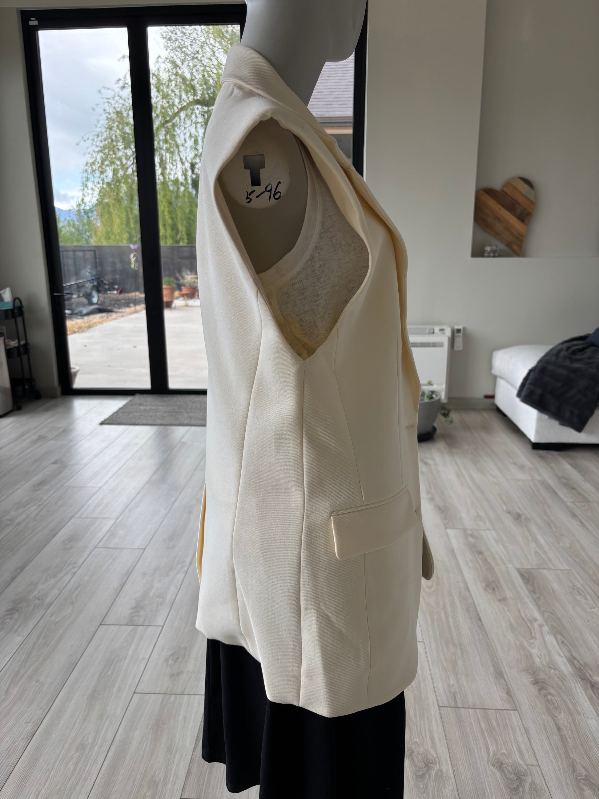 Side view of banana cream vest oversized size S.  Very classy for work or play.