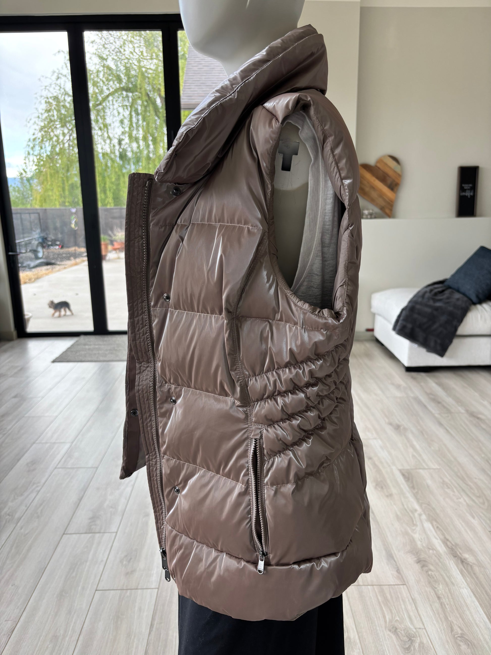 Cozy fall outfit with Athleta Downtown Vest metallic puffer vest and hoodie overlooking forest view