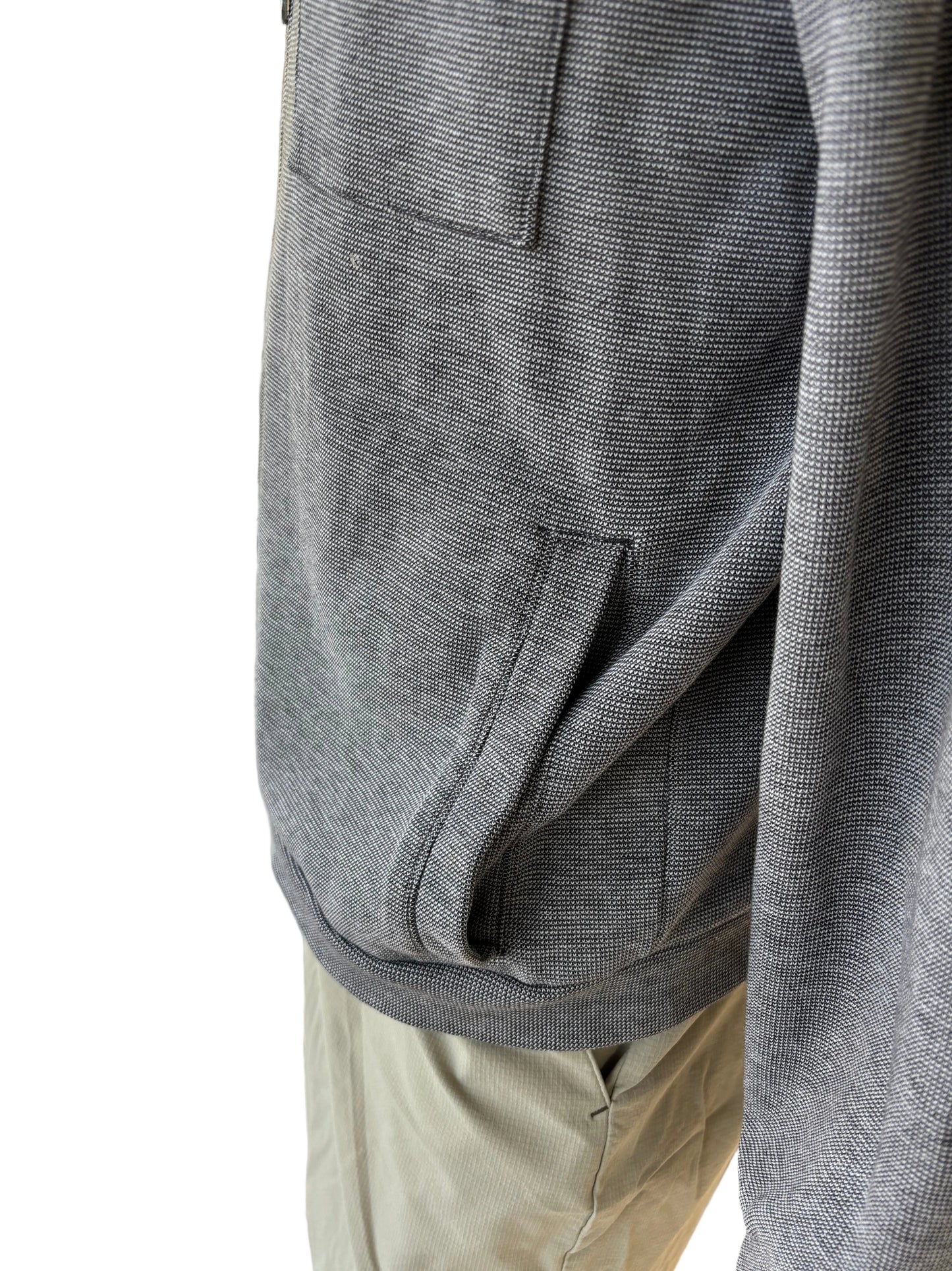 Side/pocket detail: Side detail of LinkSoul houndstooth knit zip jacket showing side pocket and ribbed hem, gray size L