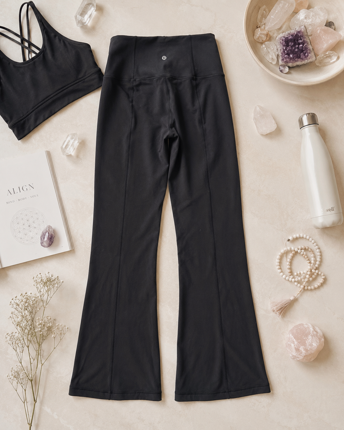 Black Lululemon high rise flare yoga pants with compressive older fabric feel