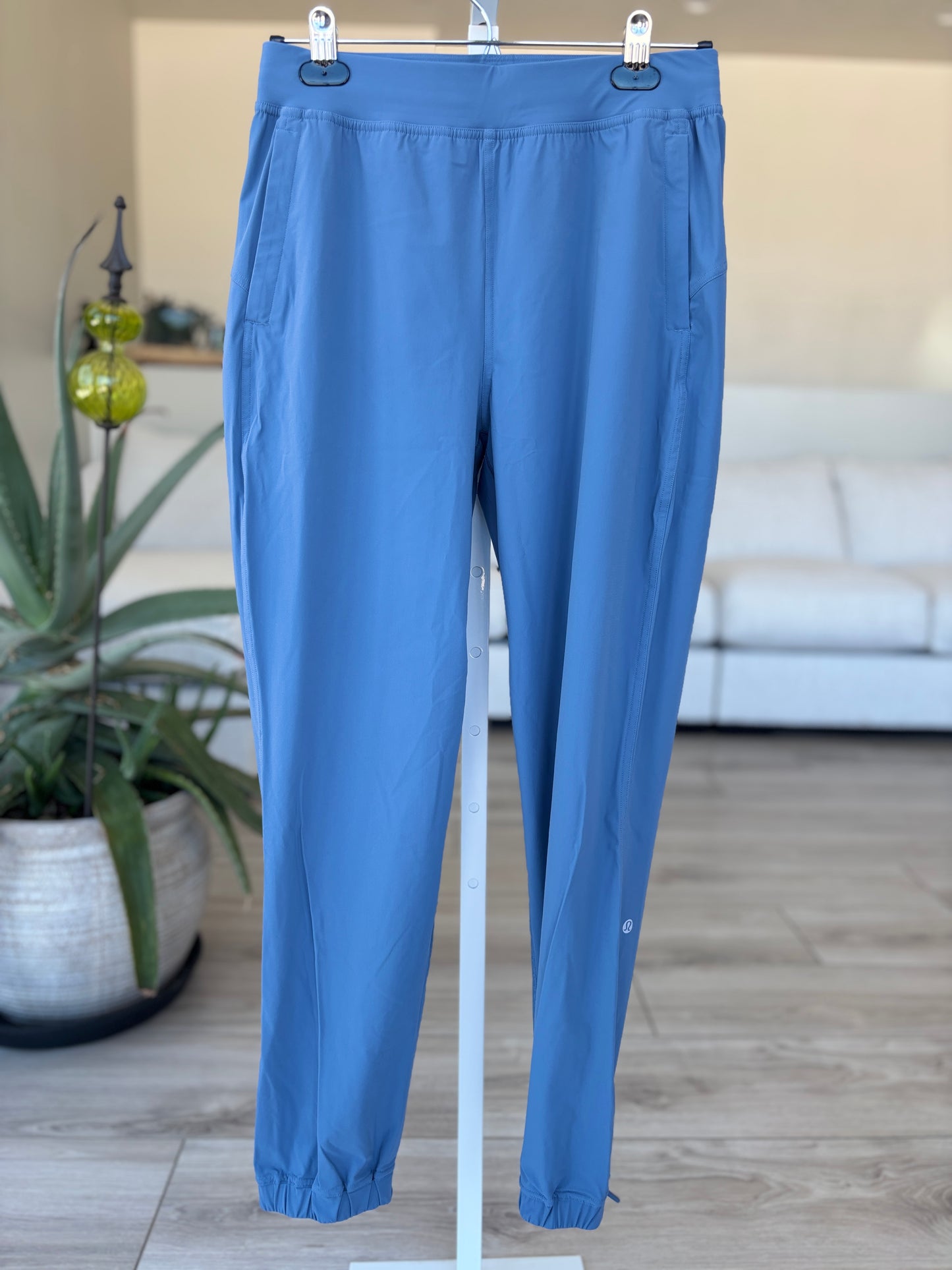 Lululemon size 6 blue athletic joggers with recycled nylon stretch fabric side pockets and zipper ankle openings