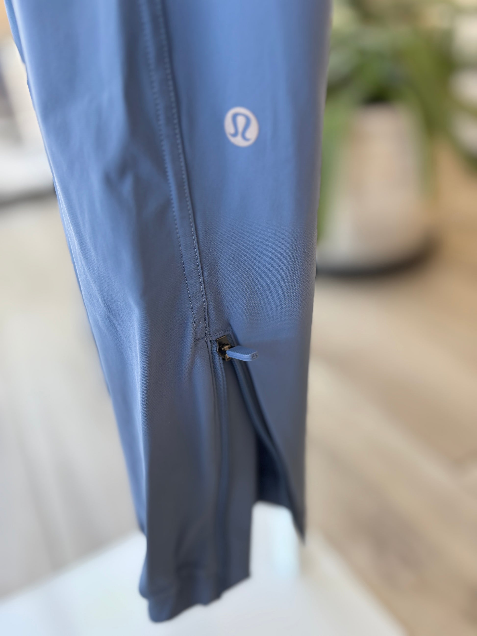 Blue Lululemon zip hem jogger pants size 6 with smooth waistband and lightweight technical fabric from Adored Again boutique