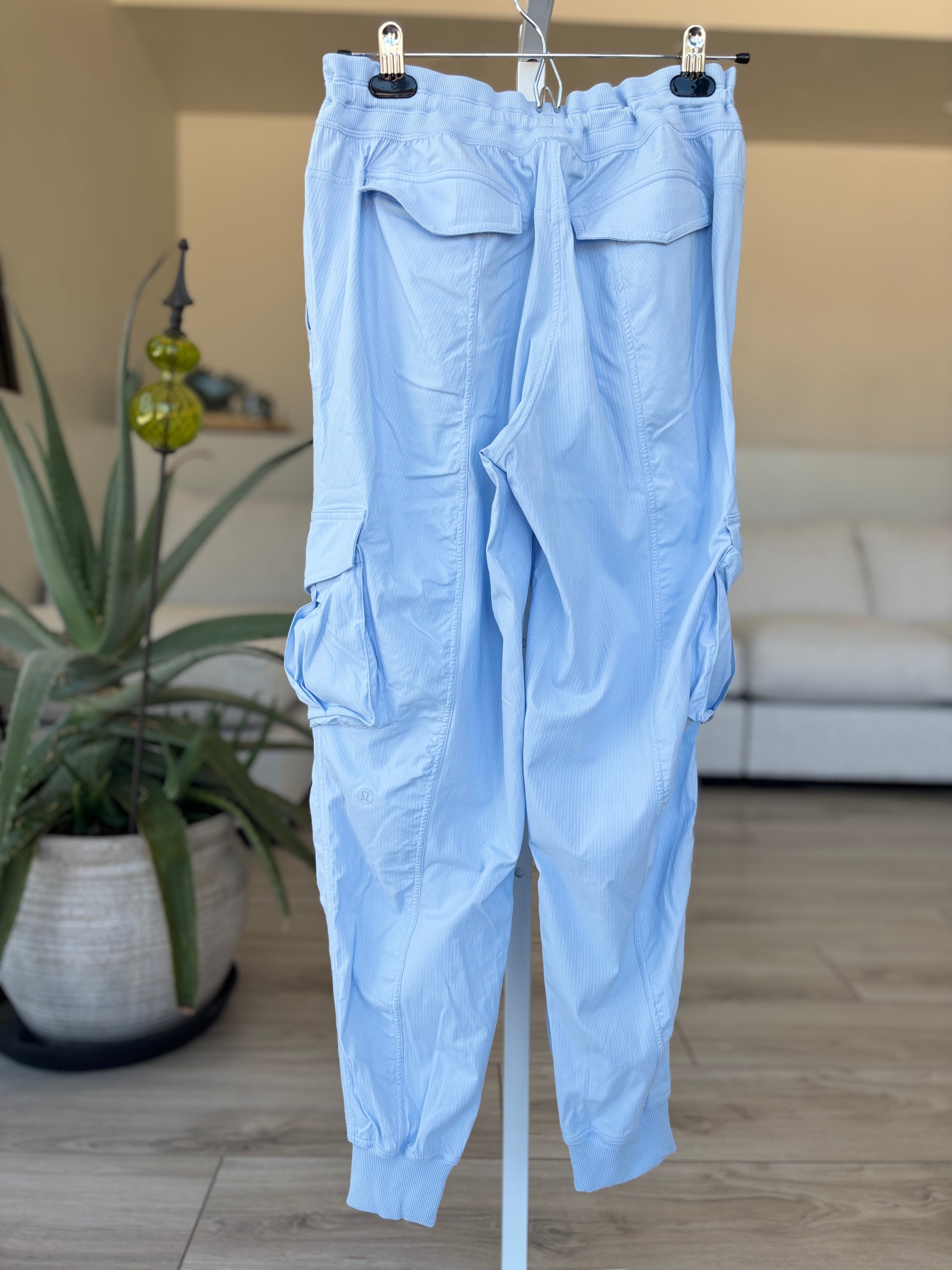 Lululemon light blue pants size S with drawstring waist back flap pockets and sporty cargo styling