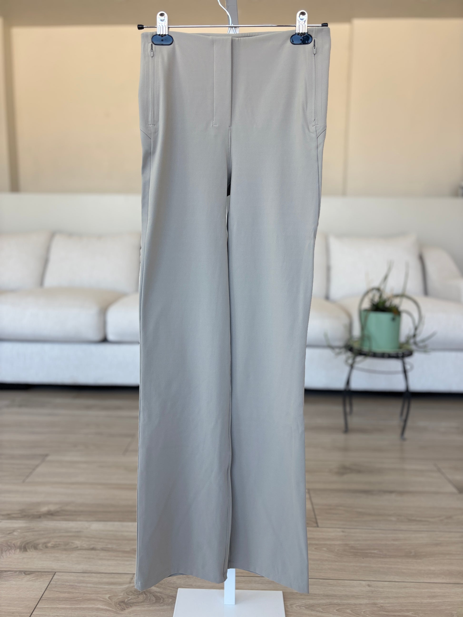Lululemon taupe gray athleisure pants with side zip pockets and performance stretch fabric from Adored Again boutique
