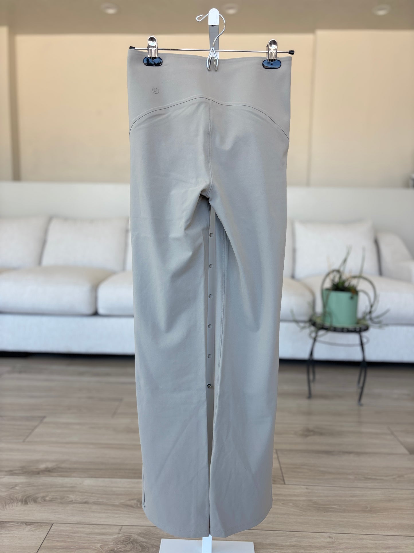 Lululemon neutral stretch pants with flattering seat and subtle flare leg from Adored Again boutique