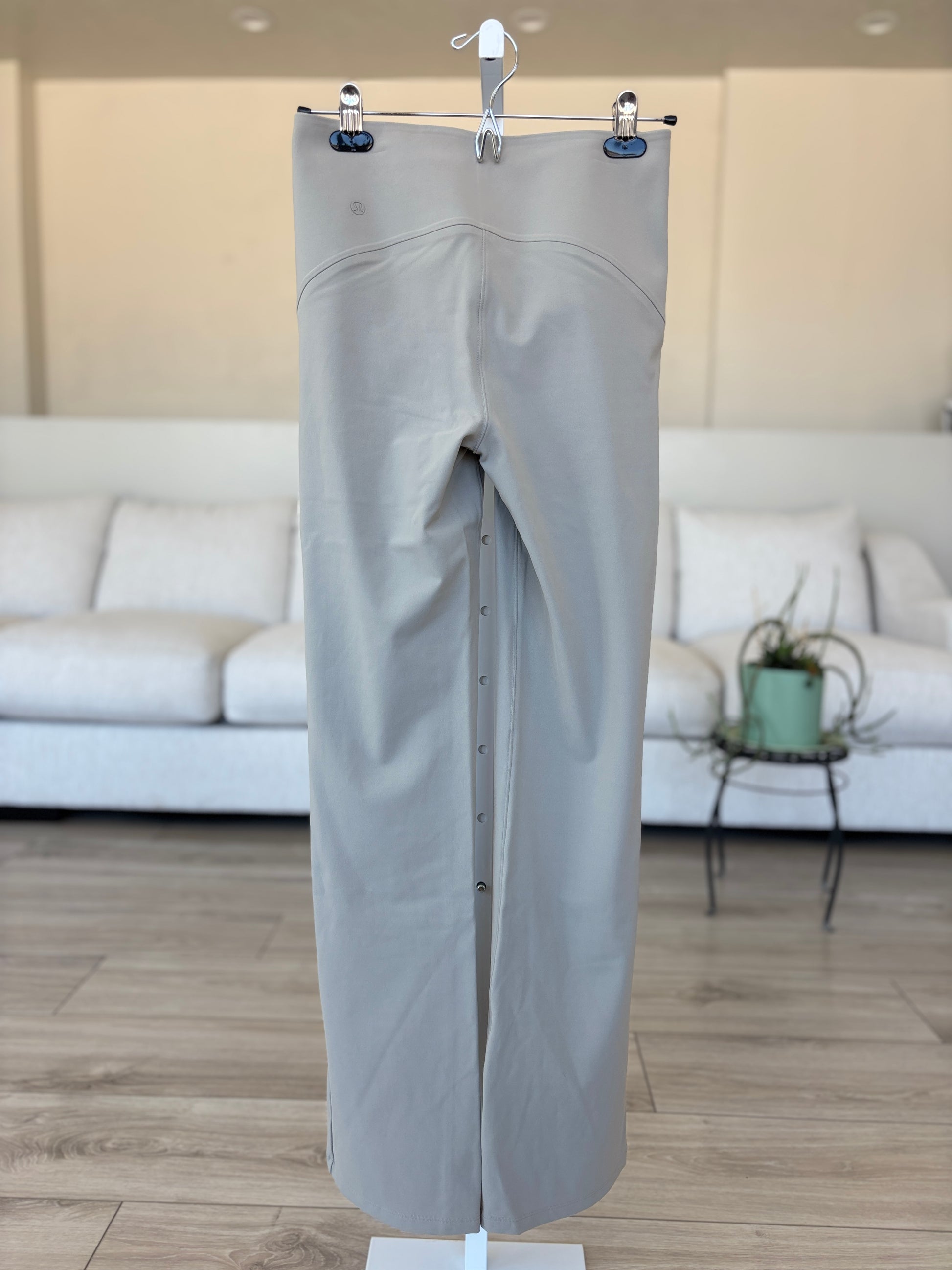Lululemon neutral stretch pants with flattering seat and subtle flare leg from Adored Again boutique