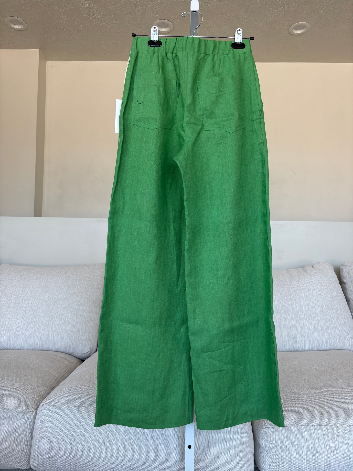 Made-in-USA jade linen trousers with a long wide-leg shape, elastic back waist, and tailored finish.