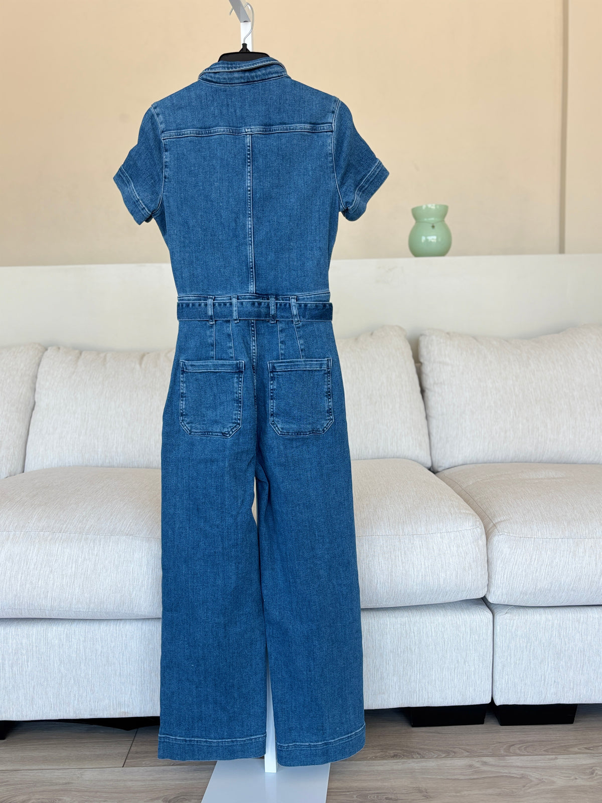 Maeve medium-blue stretch denim jumpsuit with an adjustable self-tie waist and centered metal front zipper