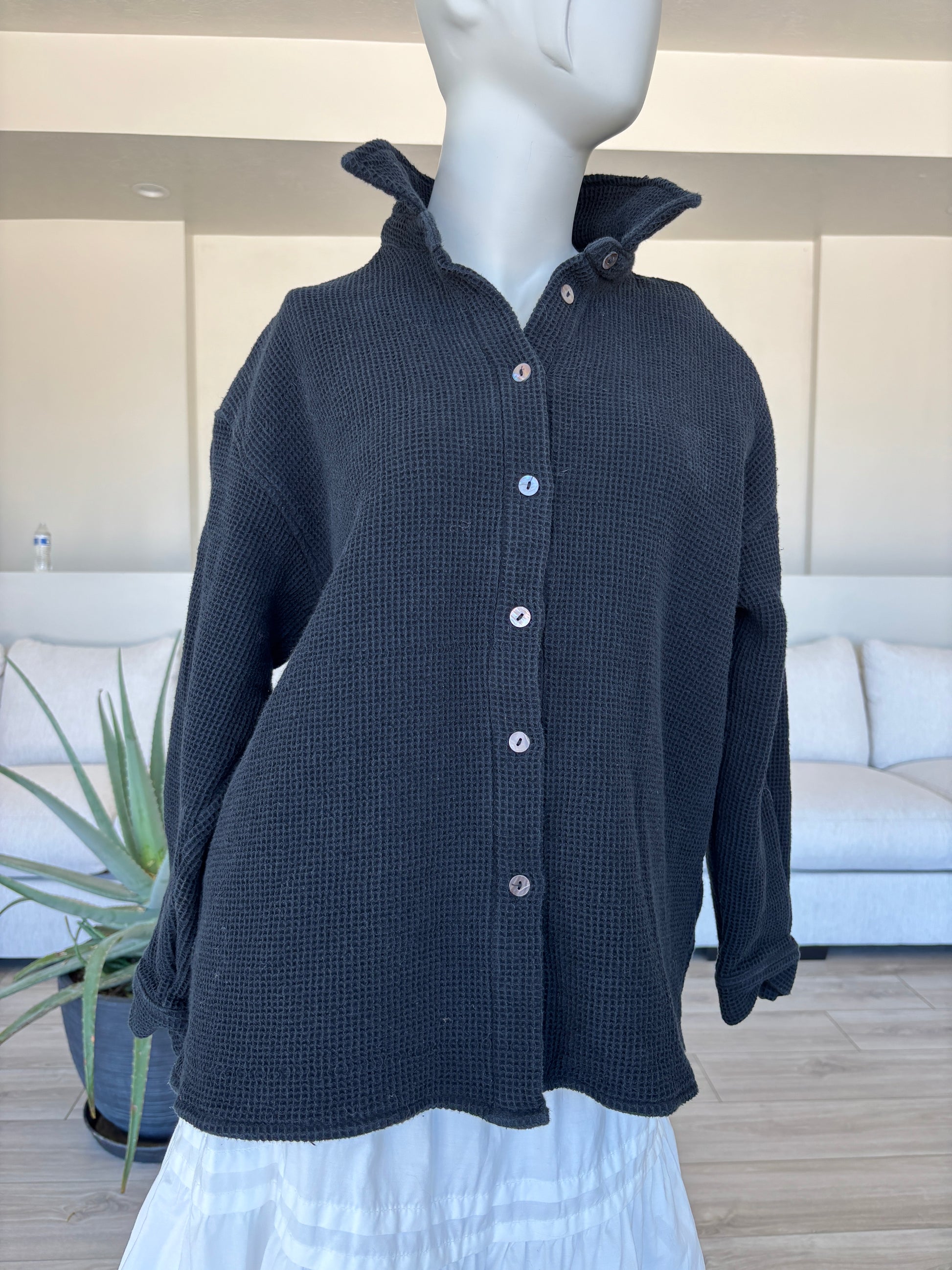 Women’s ModRef black waffle button up jacket styled as an elevated casual layer