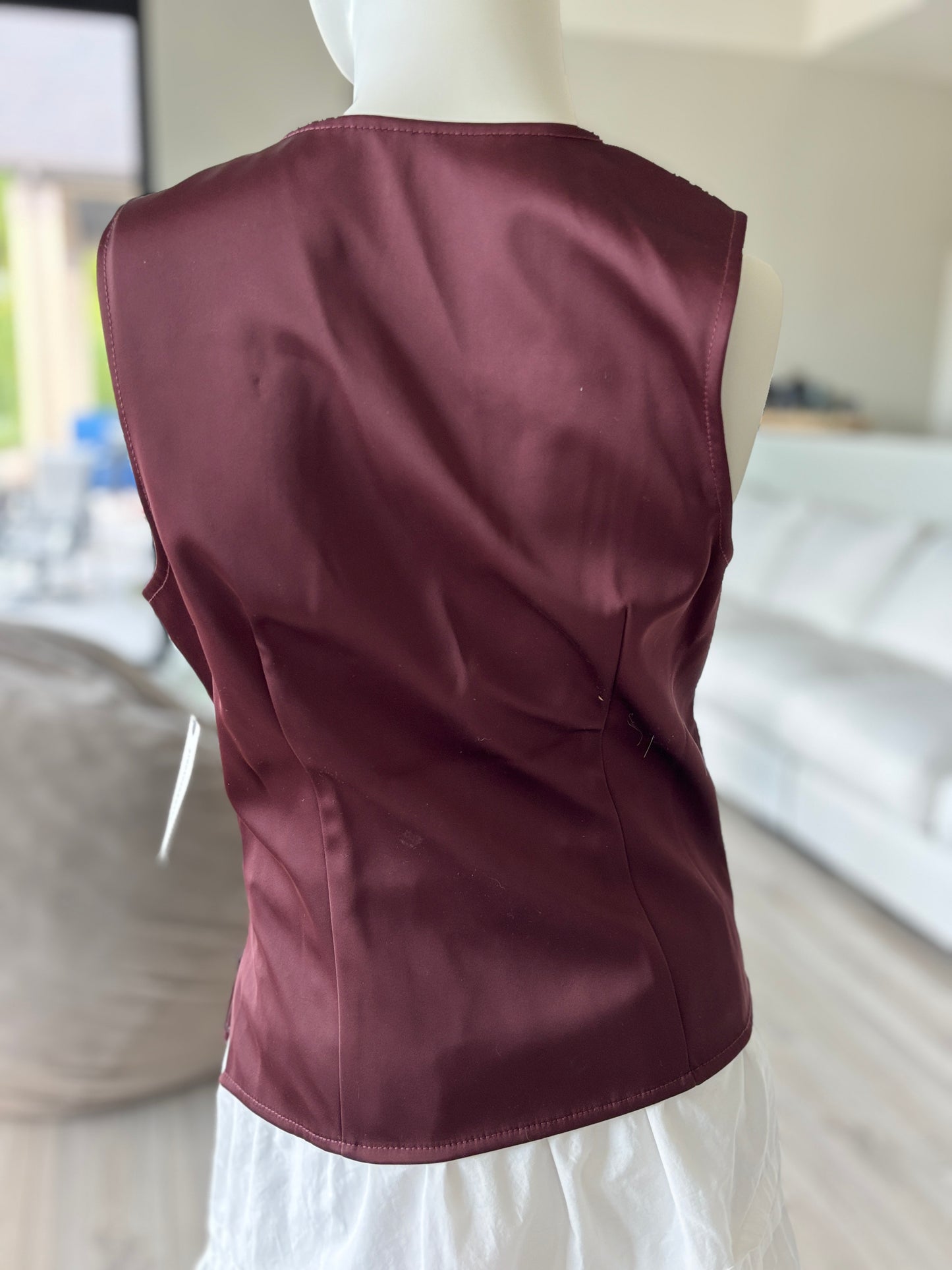 New with tags Anthropologie burgundy bustier peplum top featuring a plunging neckline and sculpted cup construction.