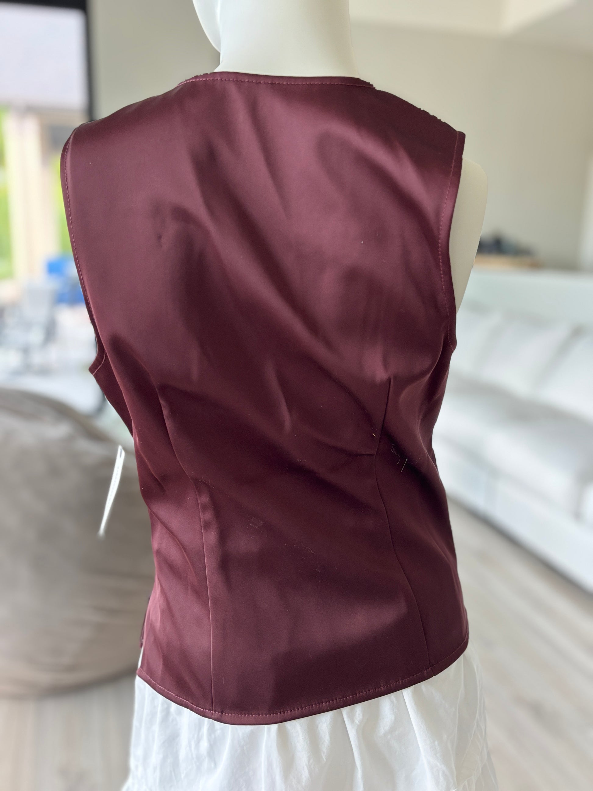 New with tags Anthropologie burgundy bustier peplum top featuring a plunging neckline and sculpted cup construction.