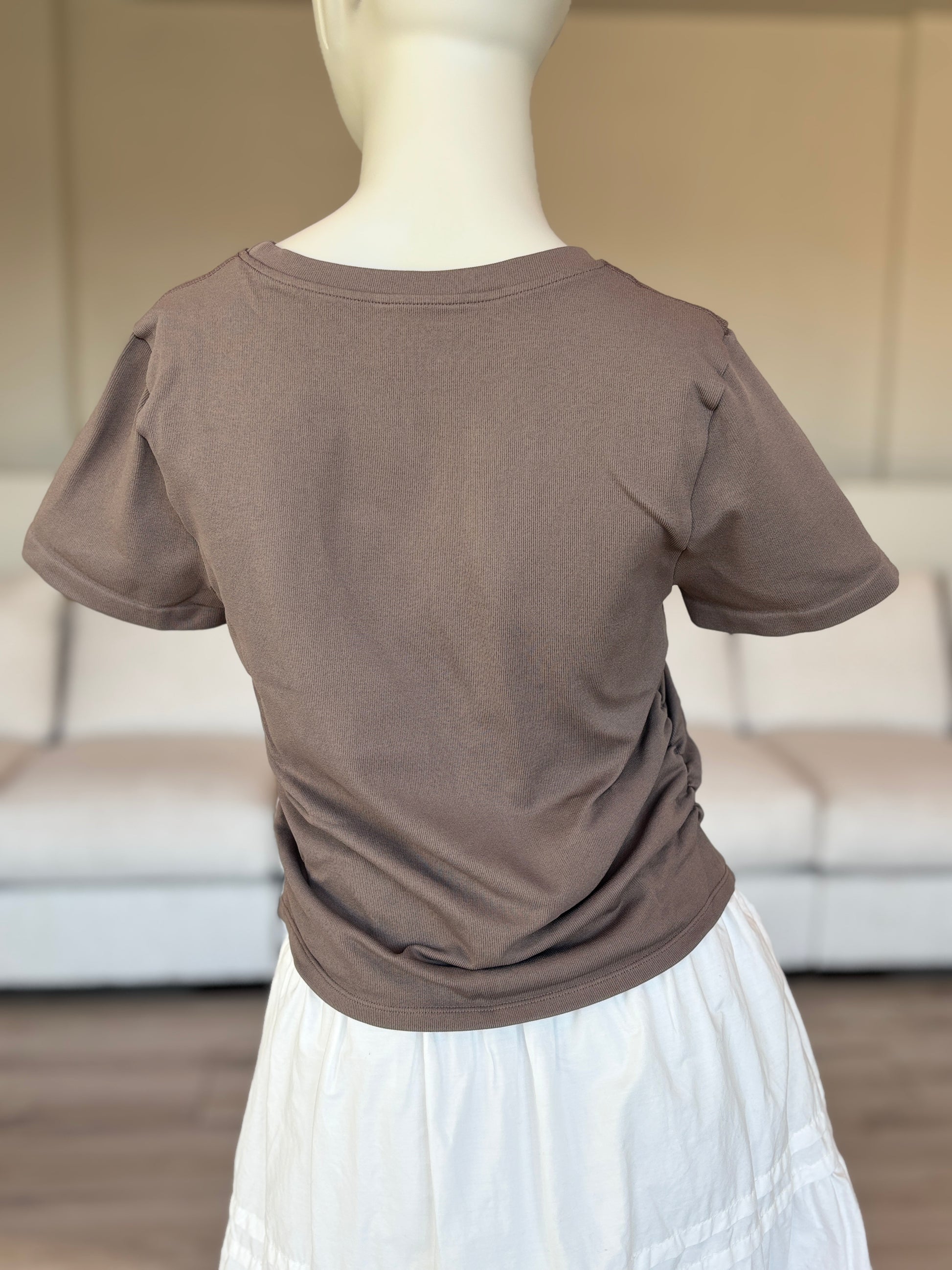 OQQ size large khaki nylon spandex top with cinched sides and short sleeves