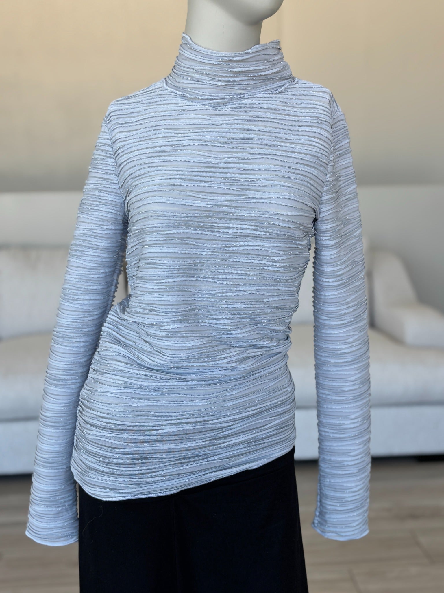 Icy gray Pilcro long sleeve top with sheer panels and metallic yarn sparkle