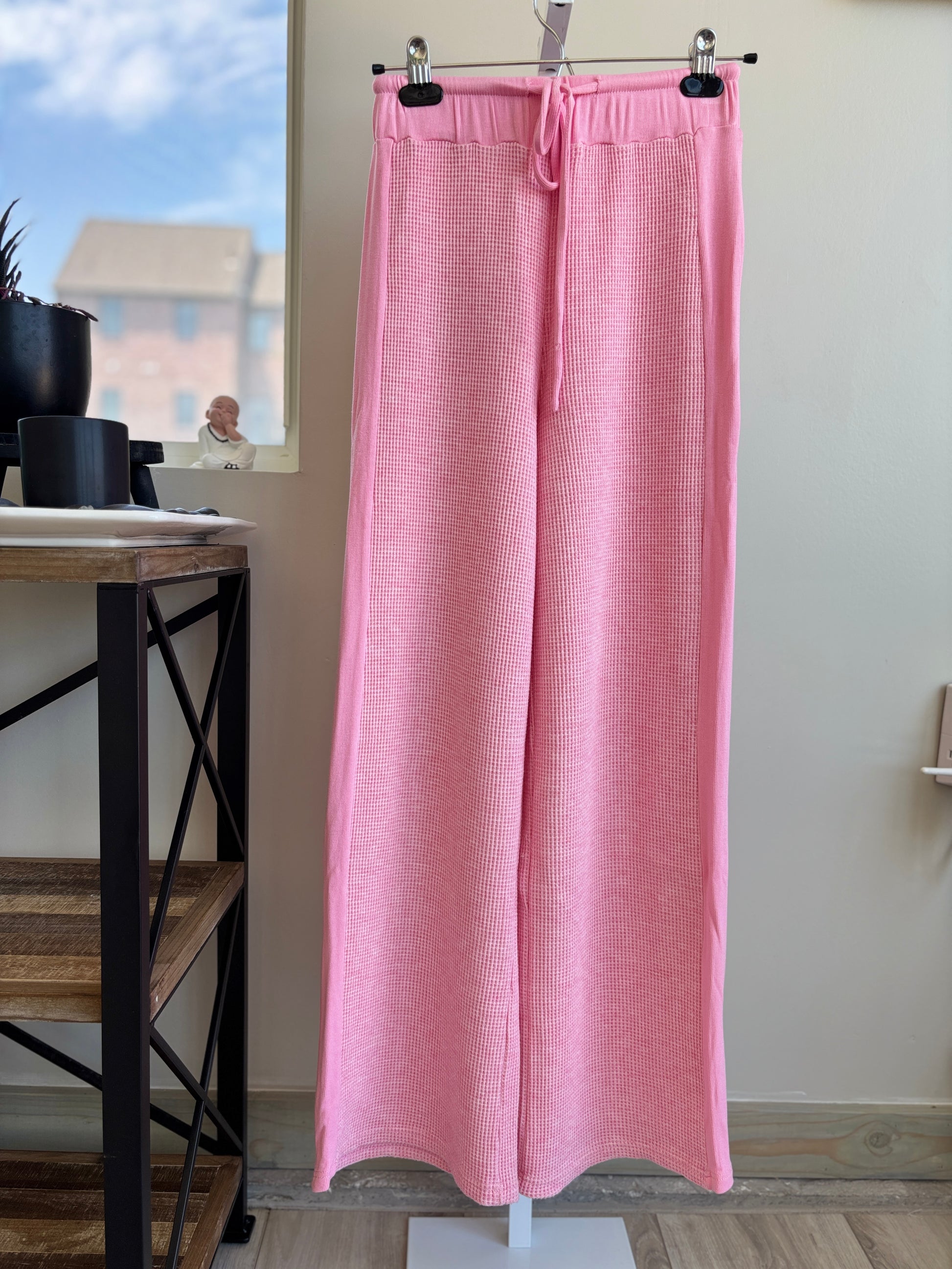 Pink Lily bright pink wide leg lounge pants with elastic tie waist and tonal side panels from Adored Again boutique