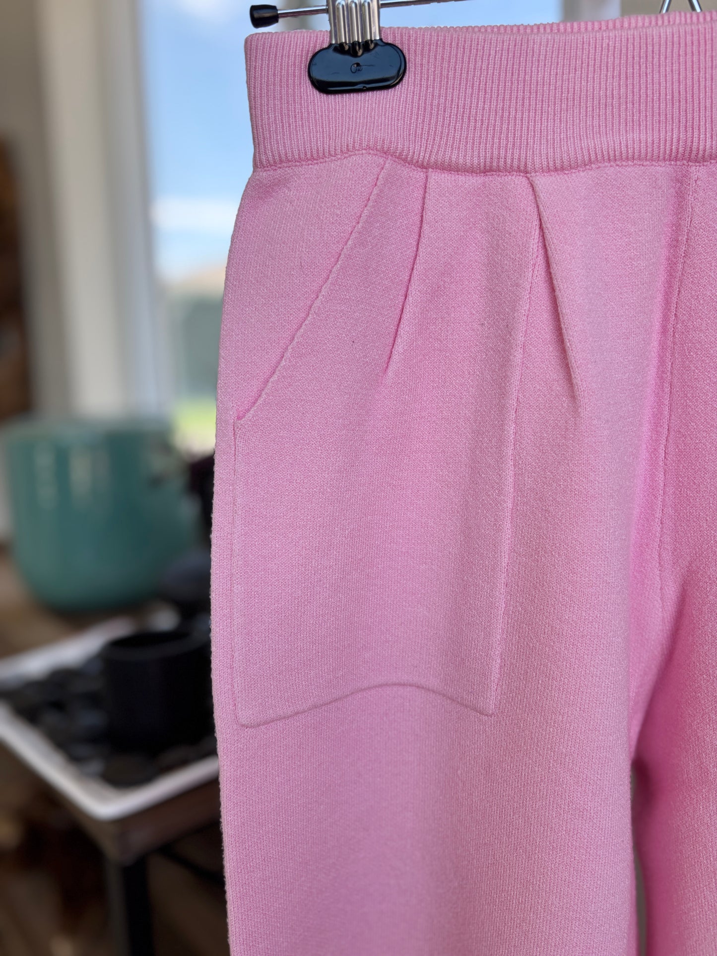 Pink Lily size small pink lounge pants in soft knit fabric with relaxed wide leg fit and front pocket detail