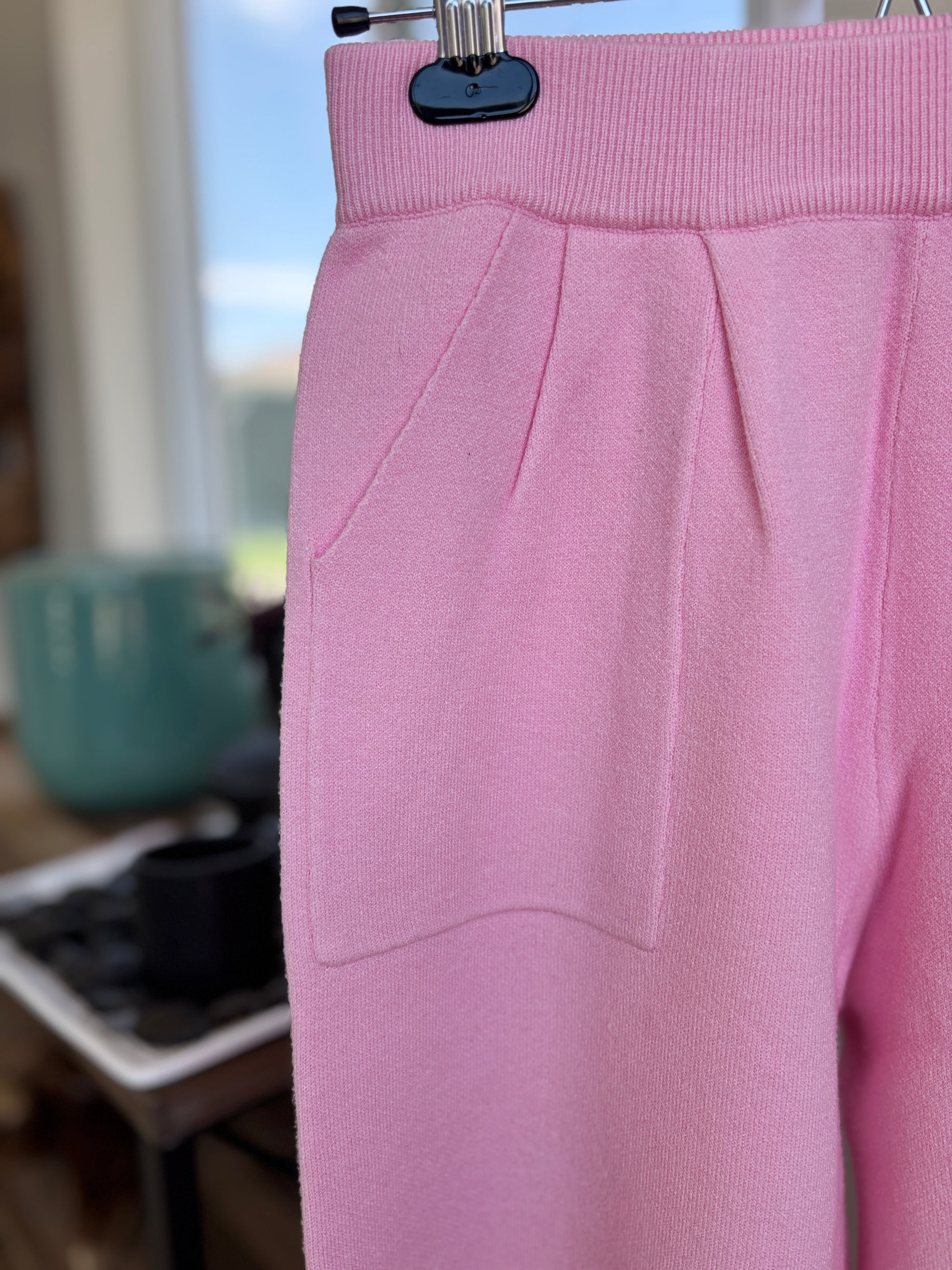 Pink Lily size small pink lounge pants in soft knit fabric with relaxed wide leg fit and front pocket detail