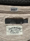 Prana Country Crewneck tag detail showing brand, size, and care information