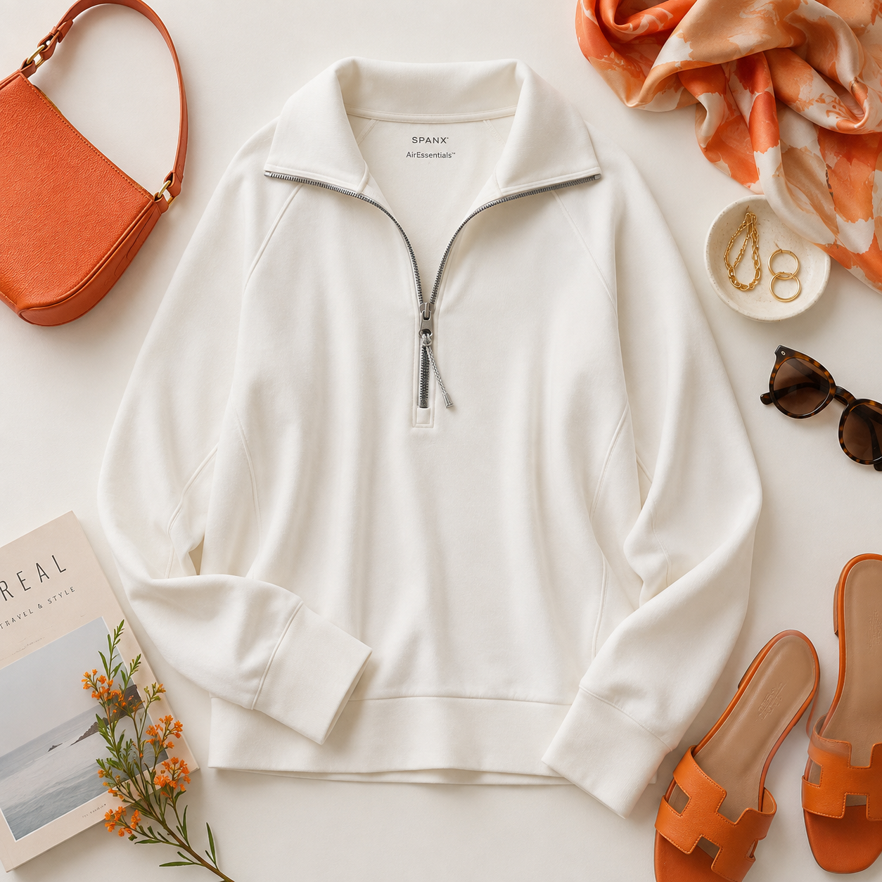 SPANX AirEssentials modal-blend half-zip top in creamy ivory with an oversized collar and smooth draped fabric.