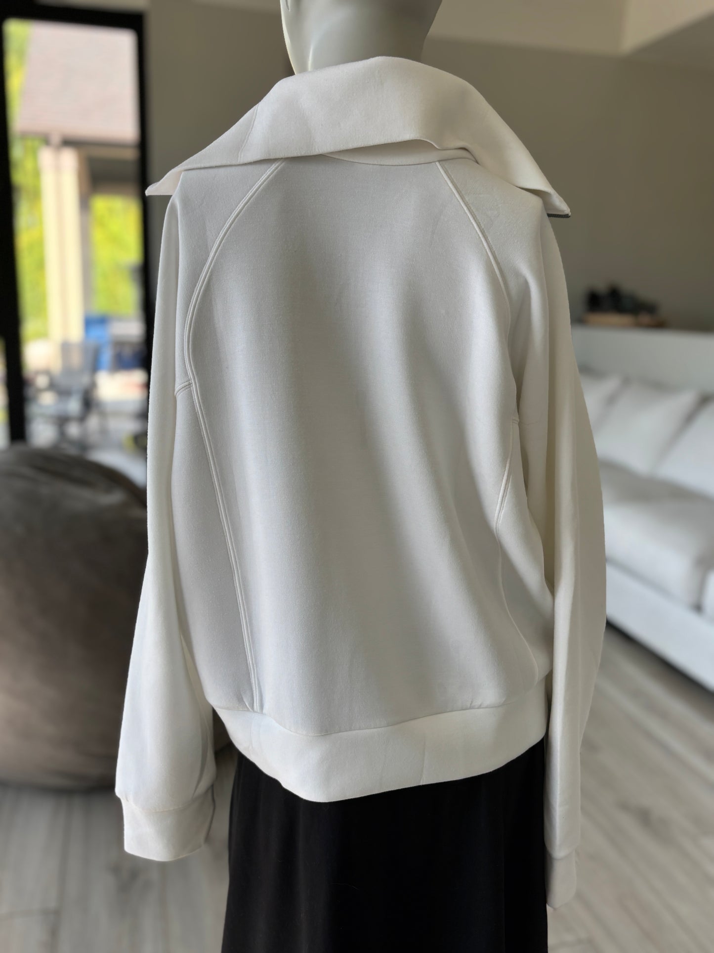 SPANX cream AirEssentials pullover with long raglan sleeves, a silver-tone zipper, and a relaxed silhouette in size M.