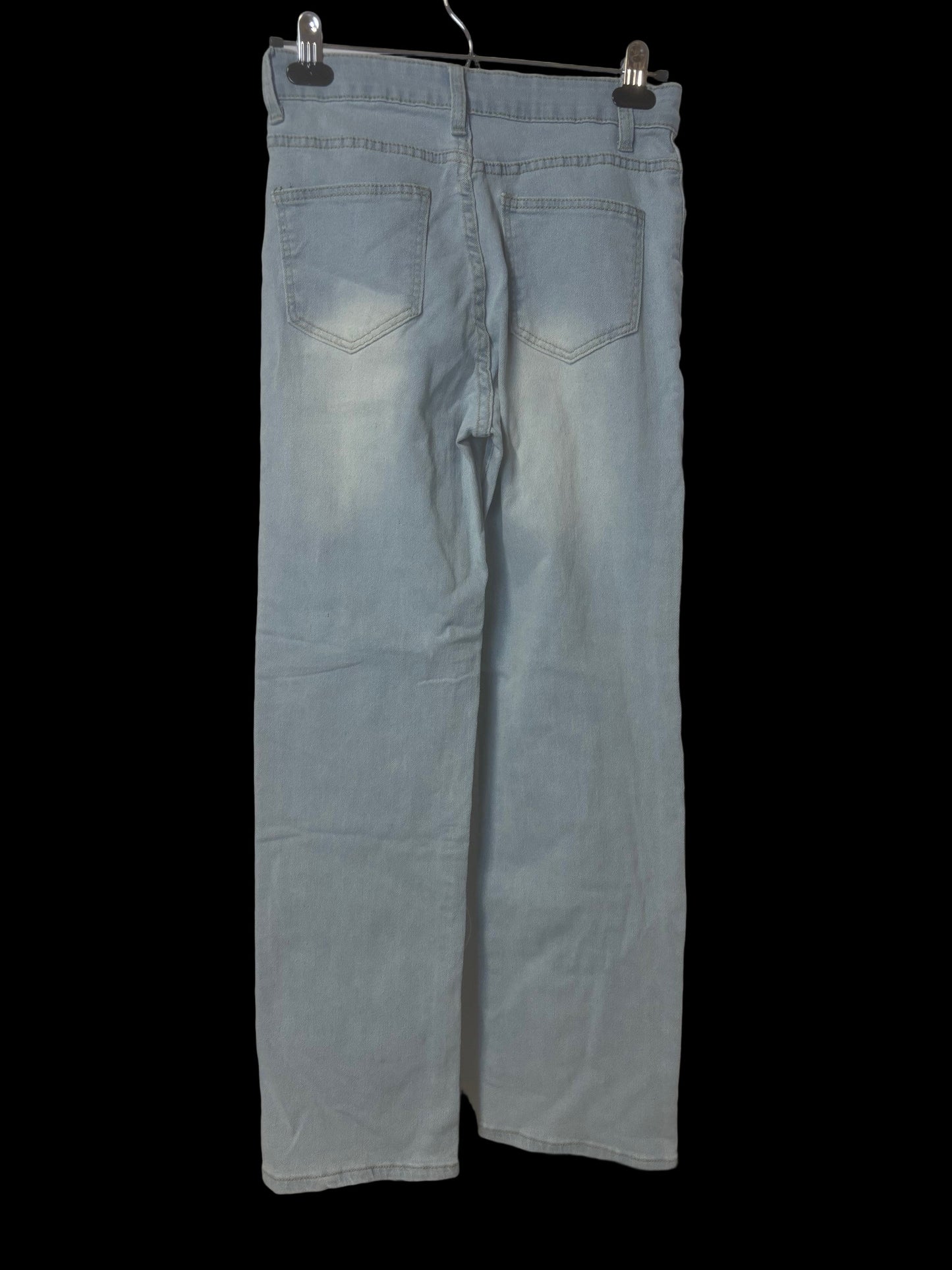 sky blue comfort jeans showing back pockets, belt loops, faded bumb, ankle length, roll up pant legs.
