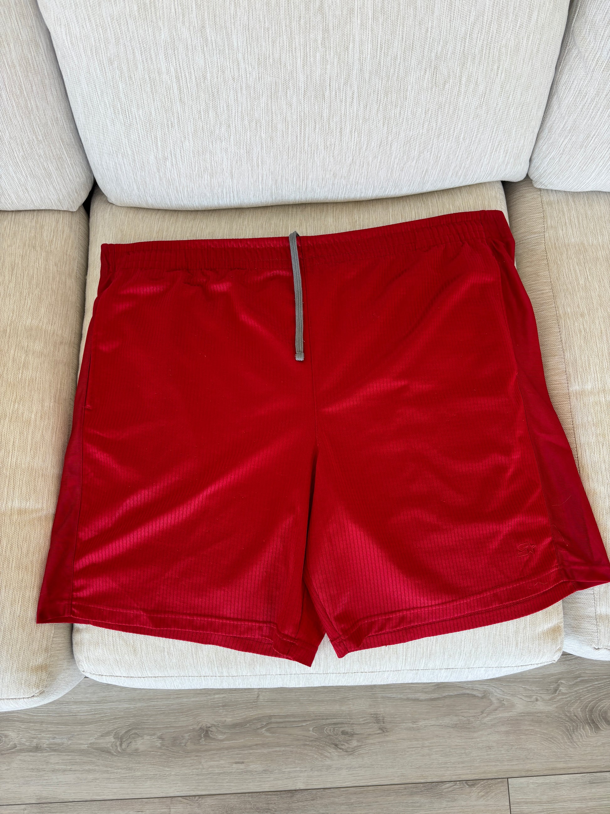 Red Starter athletic shorts for men with airy side panel detail
