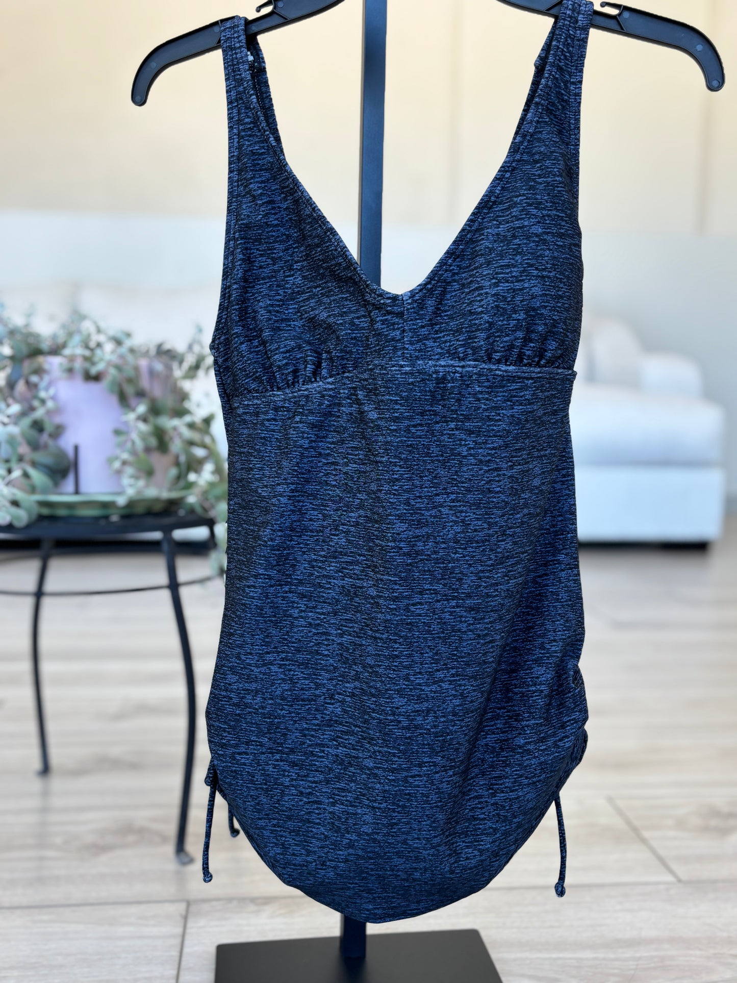 Dark blue TYR swimsuit with flattering belly drape and full brief bottom
